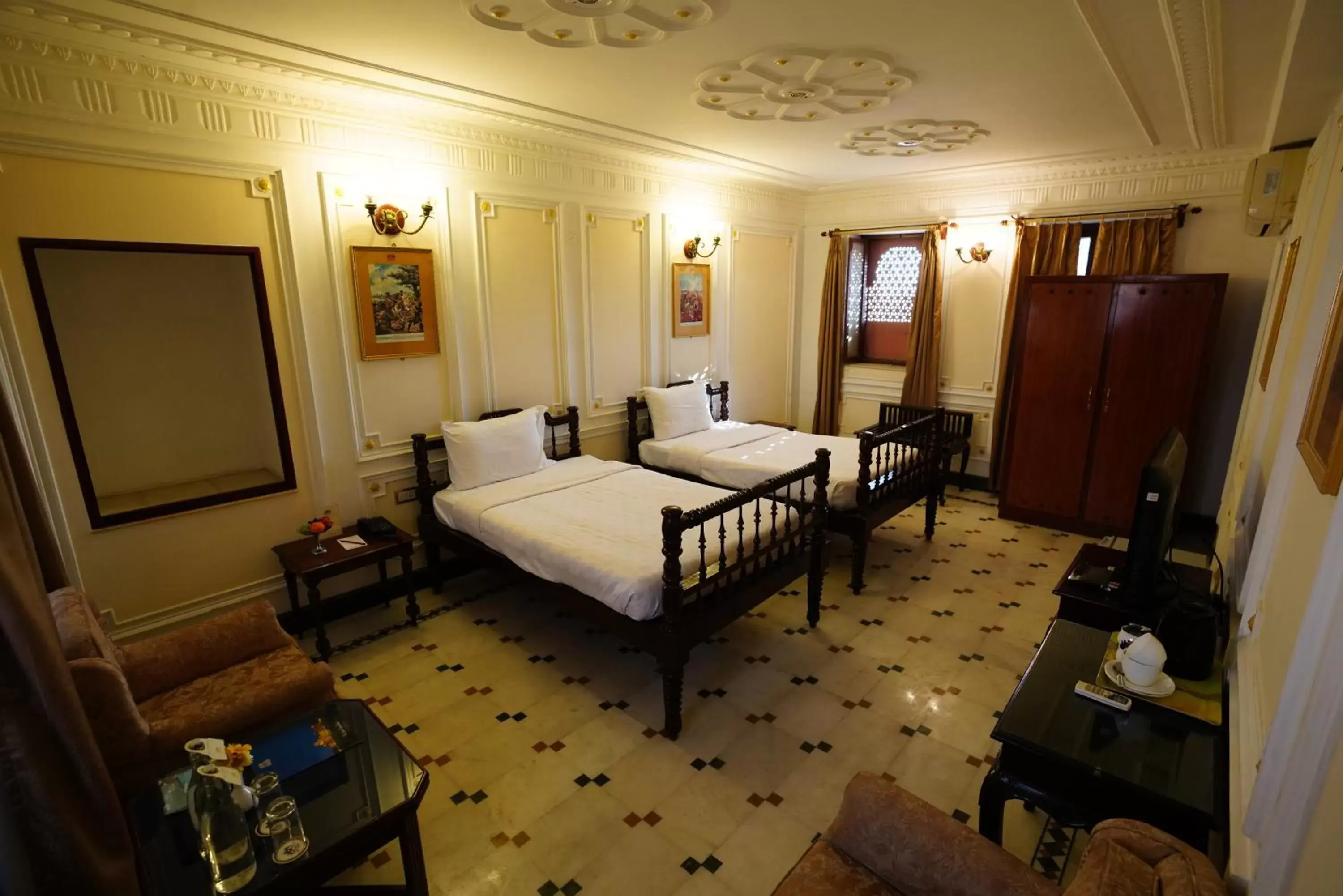 Bed, Seating Area in The Laxmi Niwas Palace