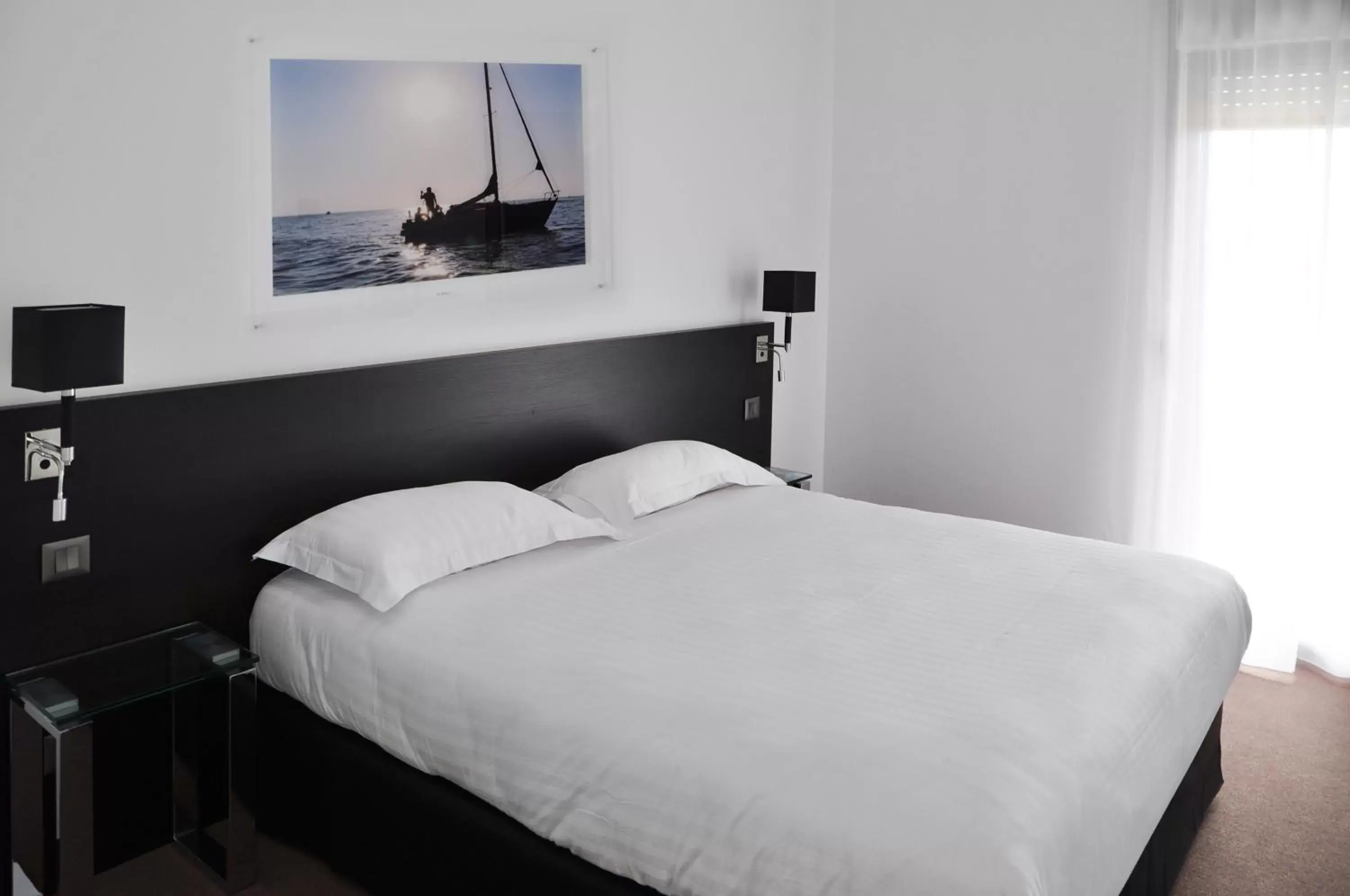 Bed, Room Photo in Golden Tulip Pornic Suites