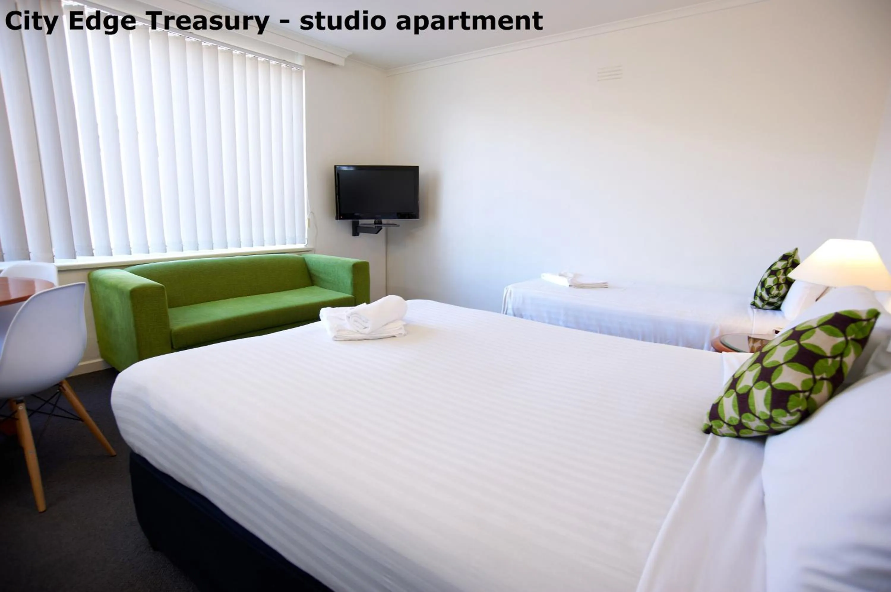 Living room, Bed in City Edge East Melbourne Apartment Hotel