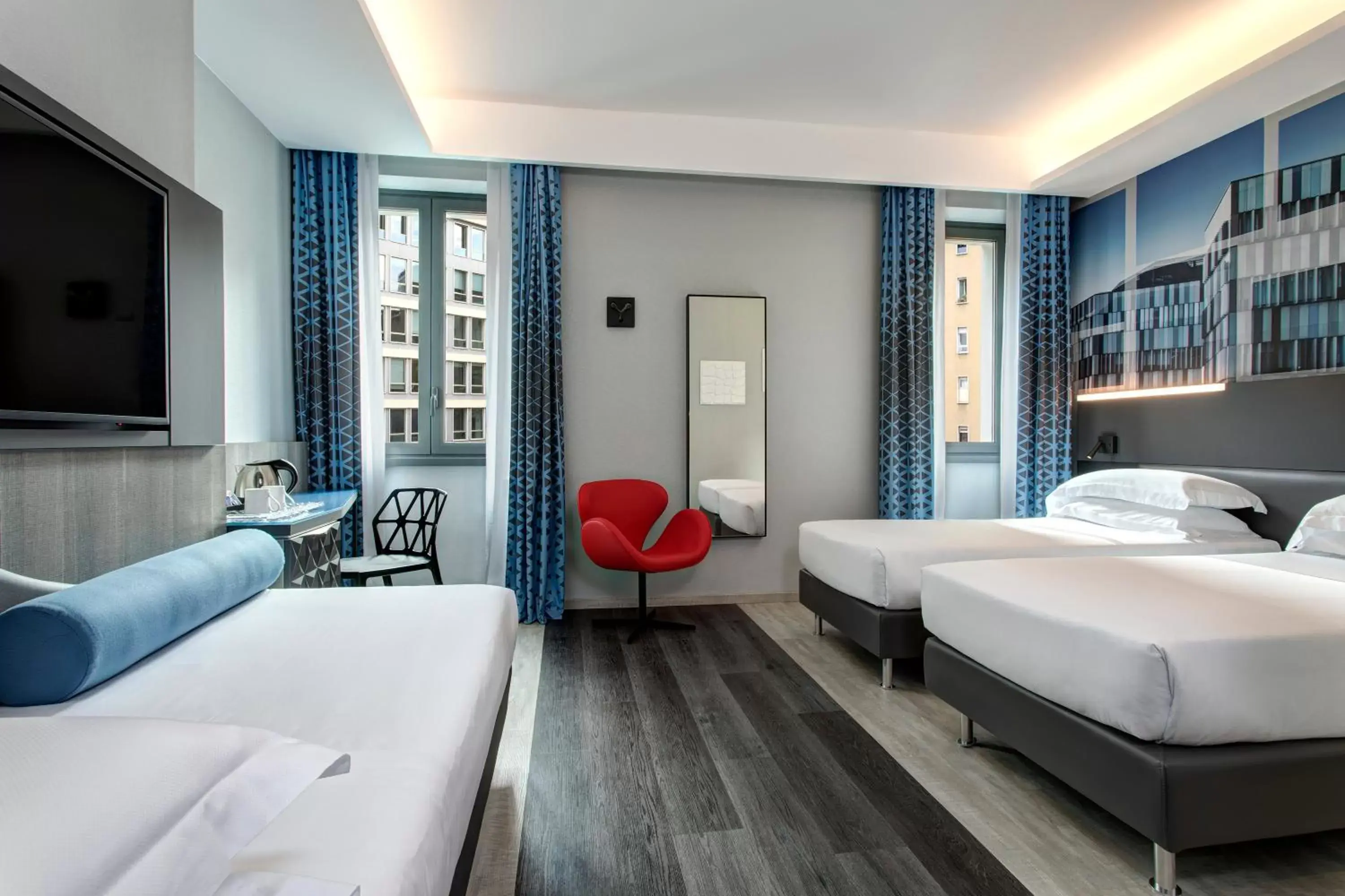 Bed in iQ Hotel Milano