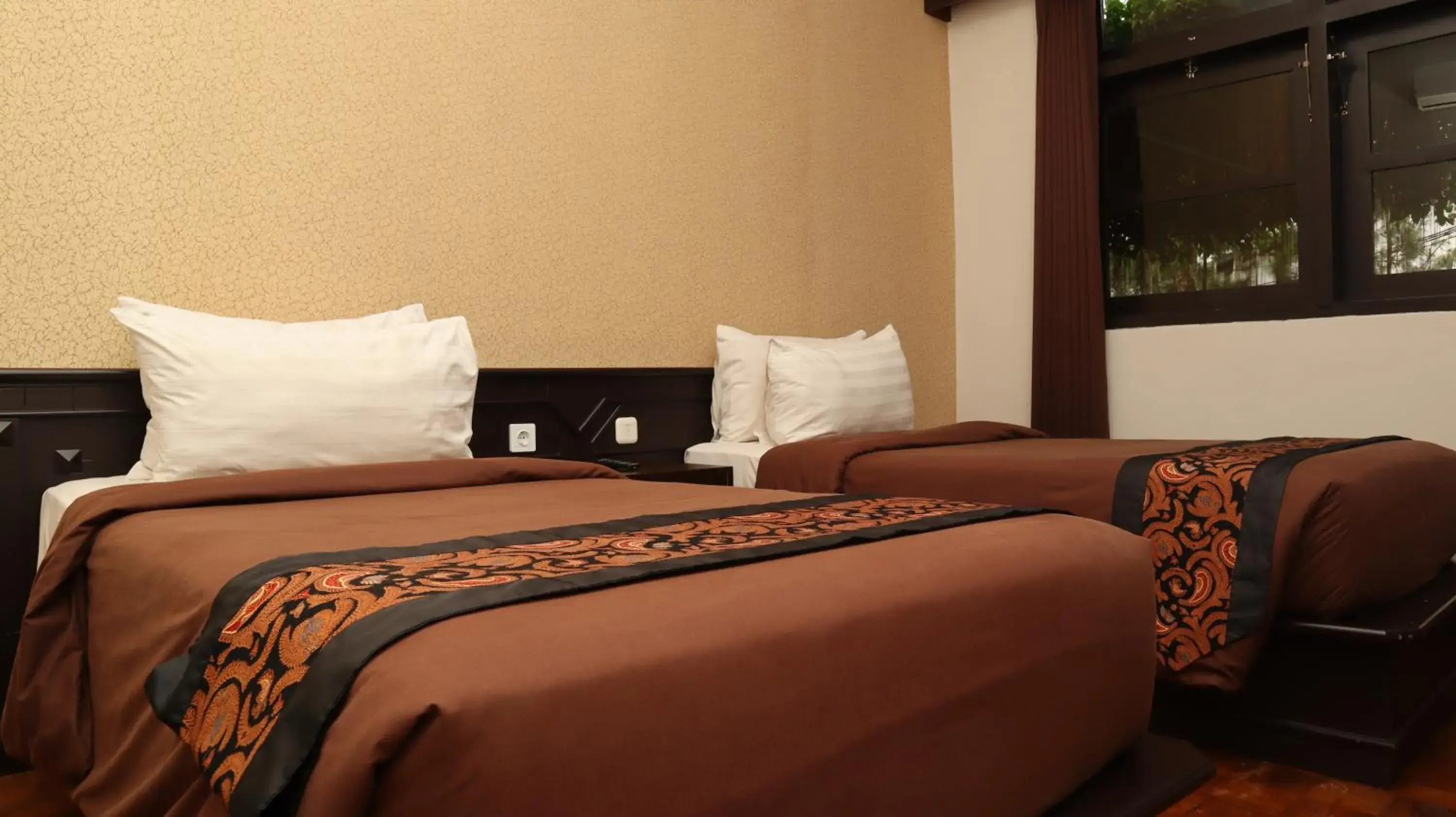 Bed in Kusuma Agrowisata Resort & Convention Bed in Kusuma Agrowisata Resort & Convention