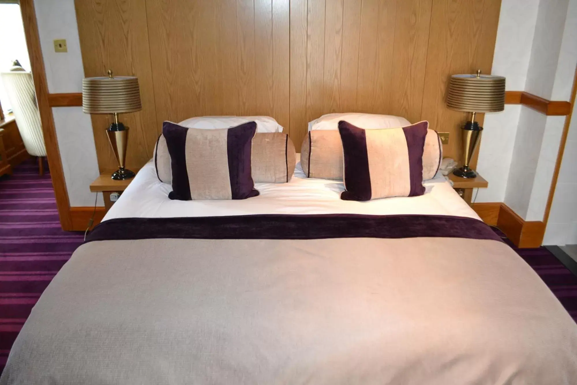 Bed in The Lensbury Resort