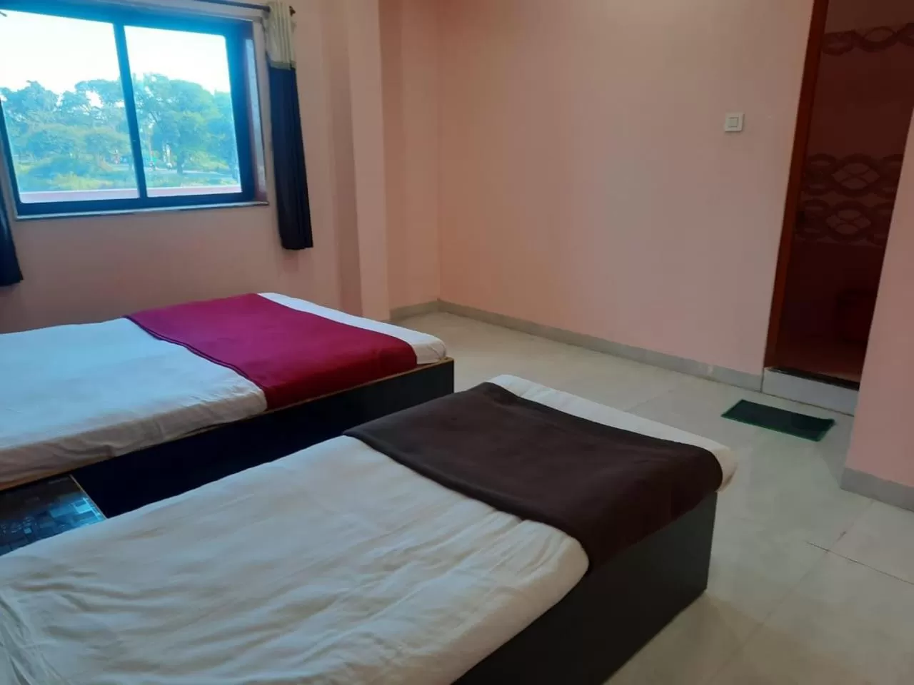 Bed in Hotel Nisarg Lodging And Restaurant