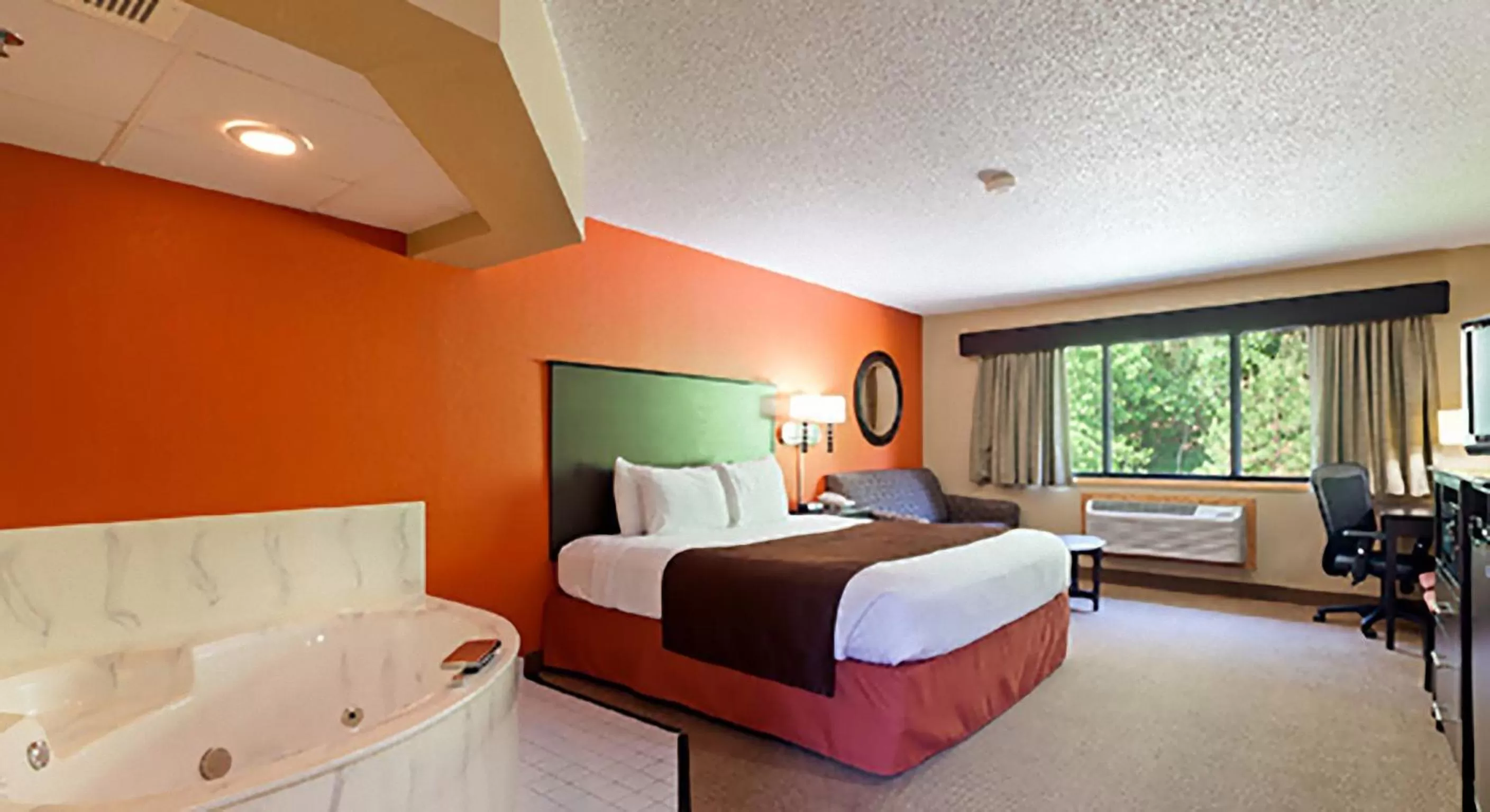 Bed in AmericInn by Wyndham Algona