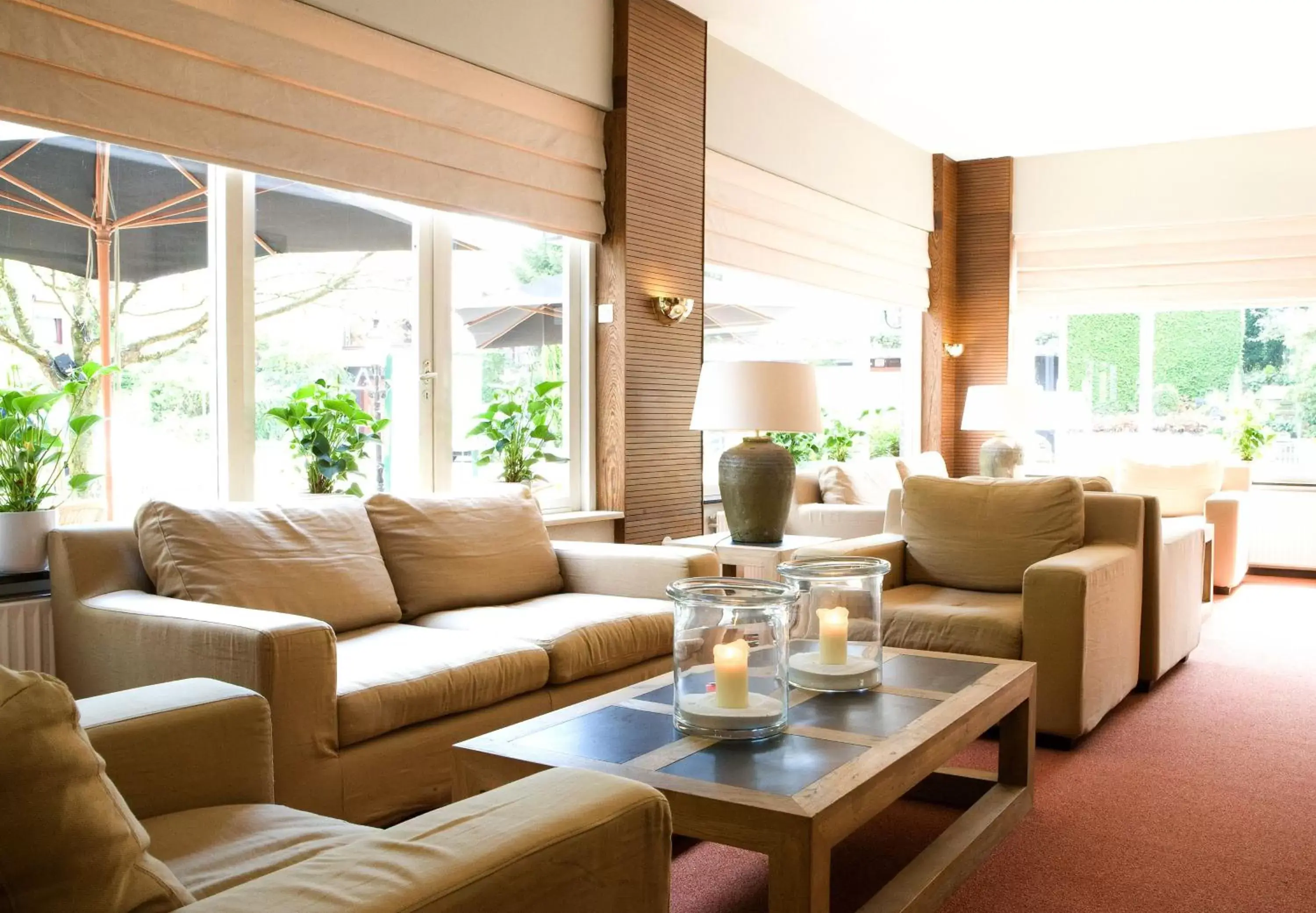 Communal lounge/ TV room, Seating Area in Fletcher Hotel Restaurant Bon Repos