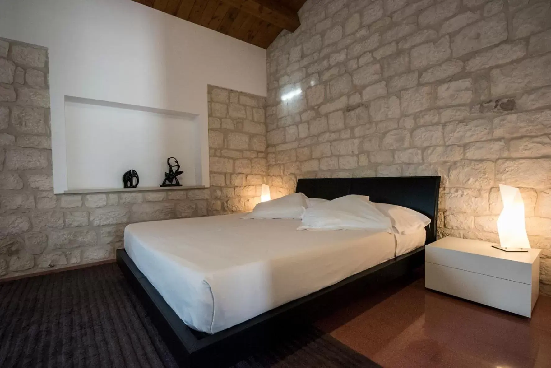 Bed in Pietre Nere Resort & Spa