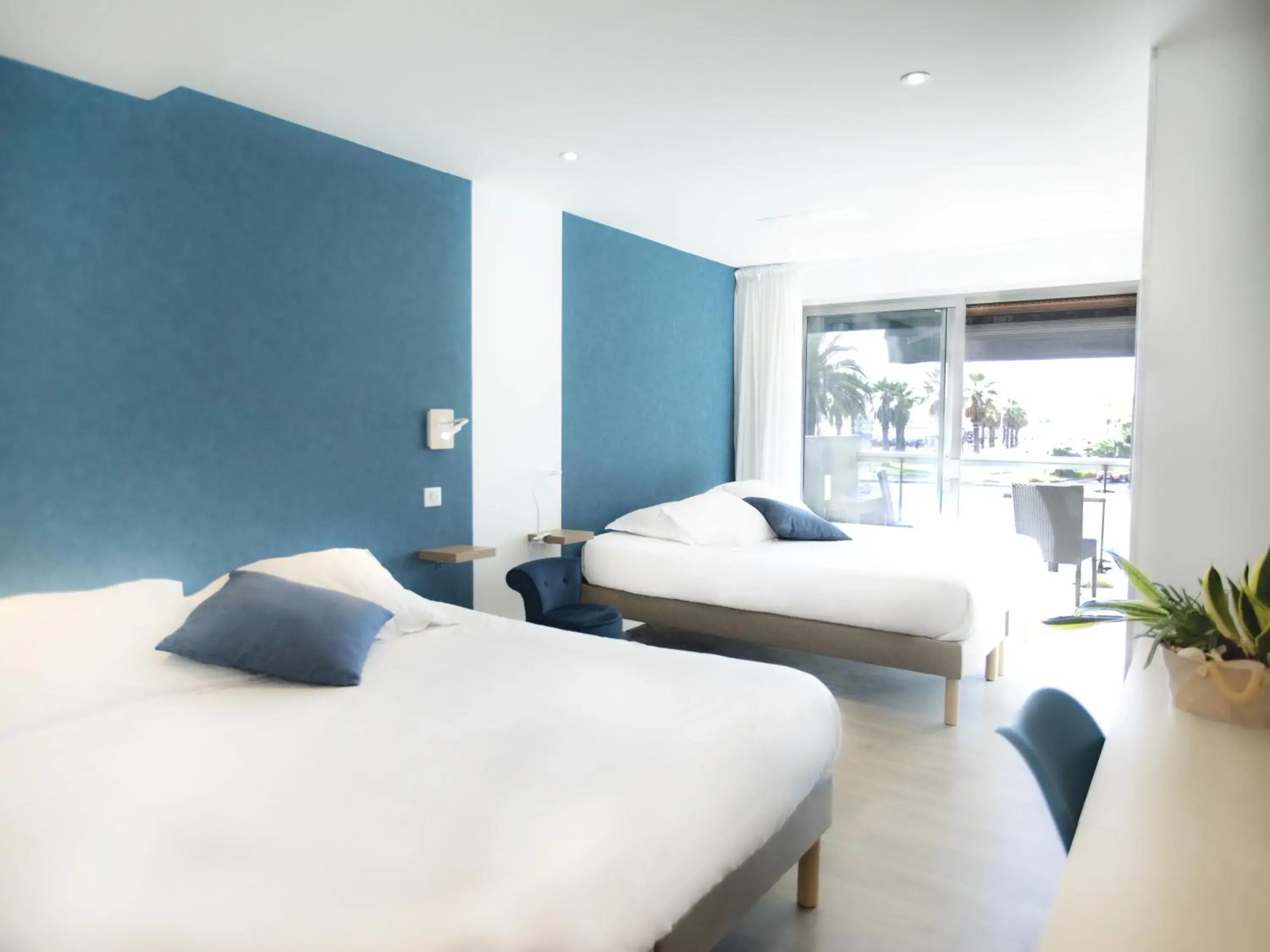 Bed in Citotel Tiercé Beach Hotel