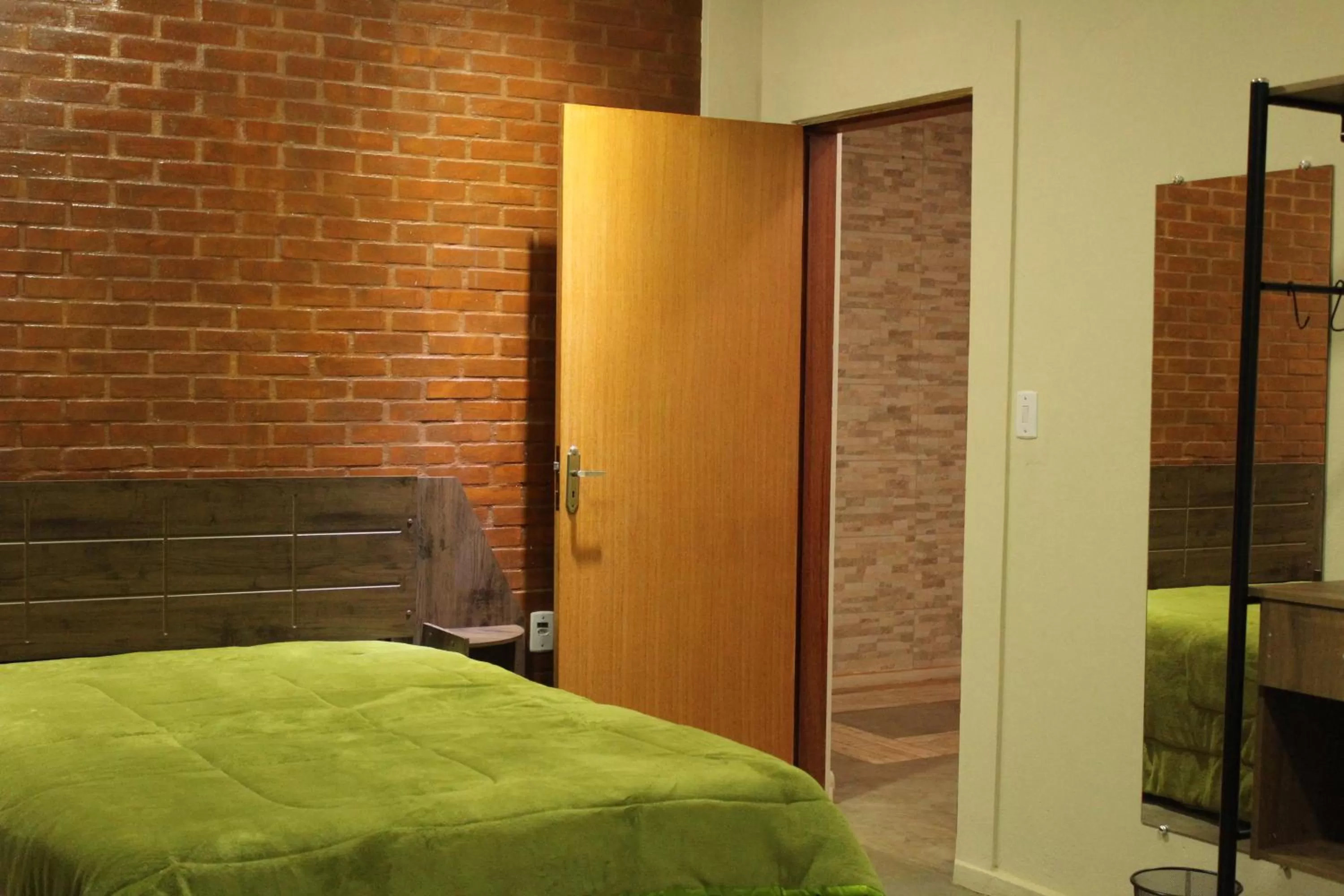 Bed in Pousada Morro dos Ventos