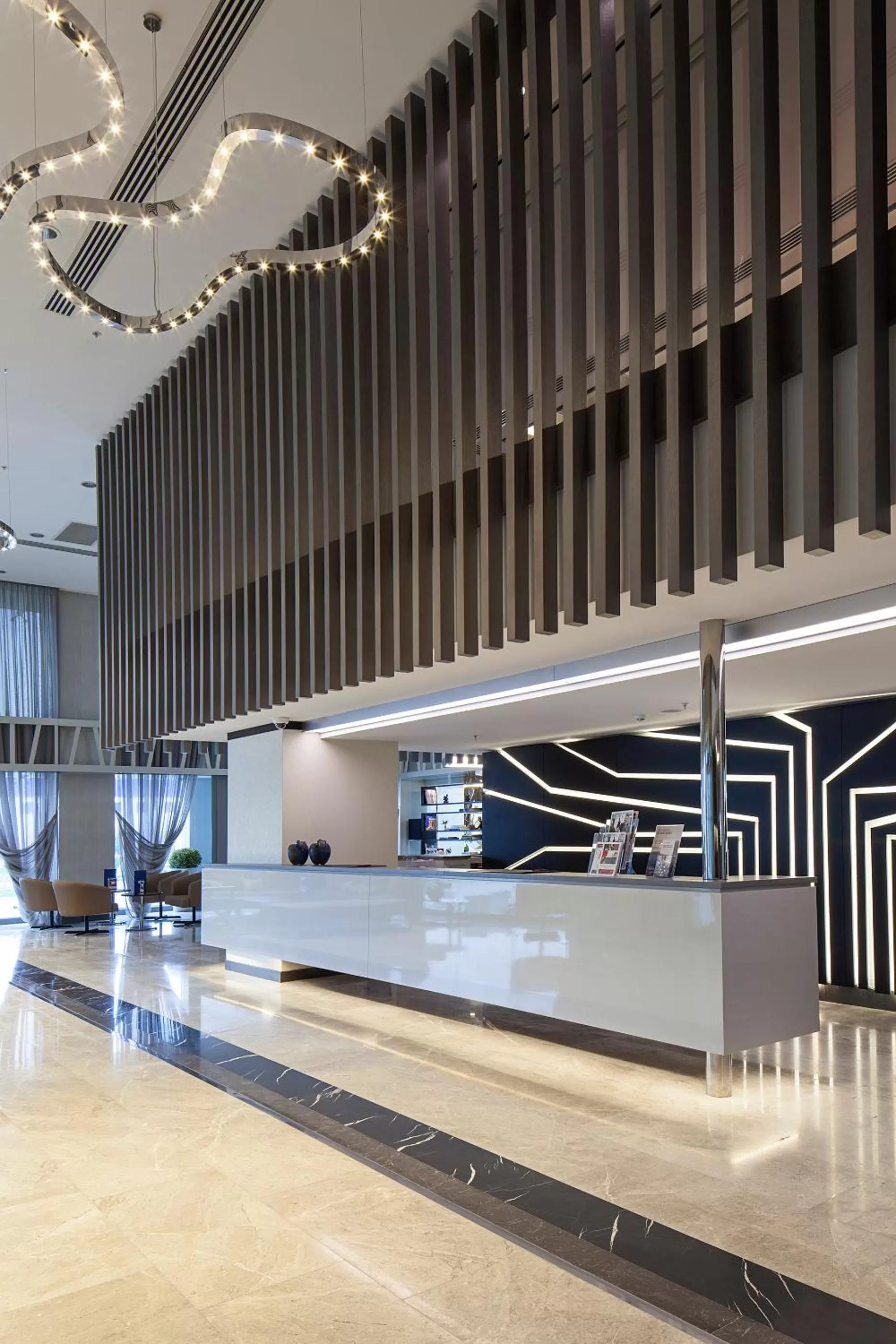 Lobby or reception in Ramada Hotel & Suites by Wyndham Izmir Kemalpasa