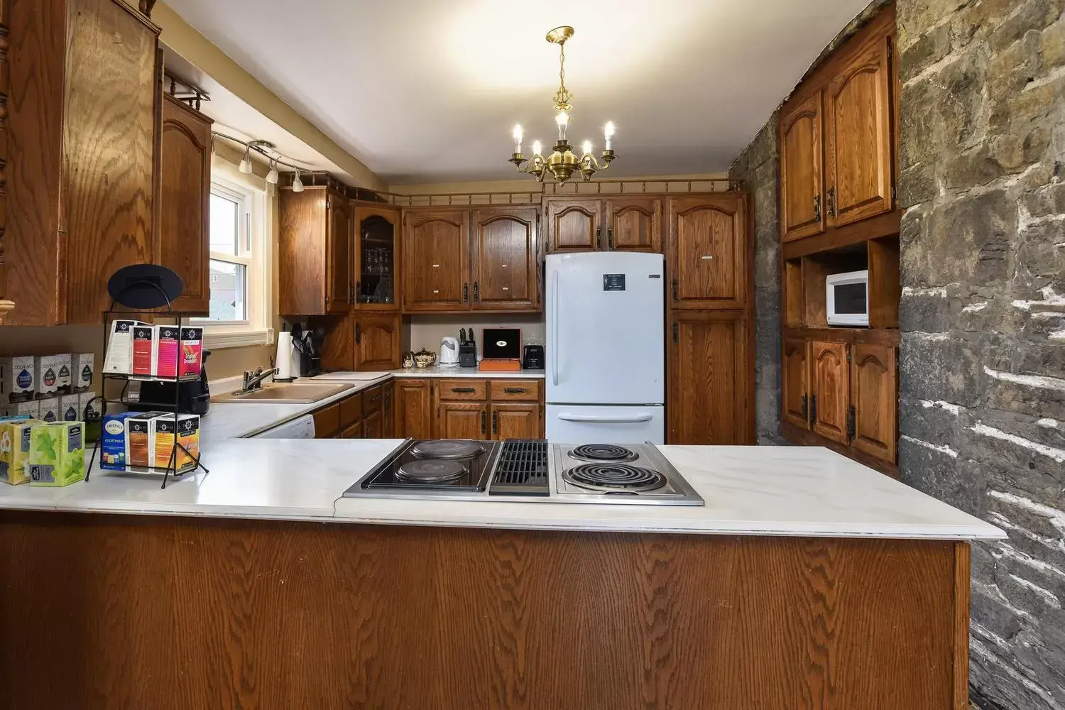 Kitchen/Kitchenette in The Noble Waterfront Apartment Suites