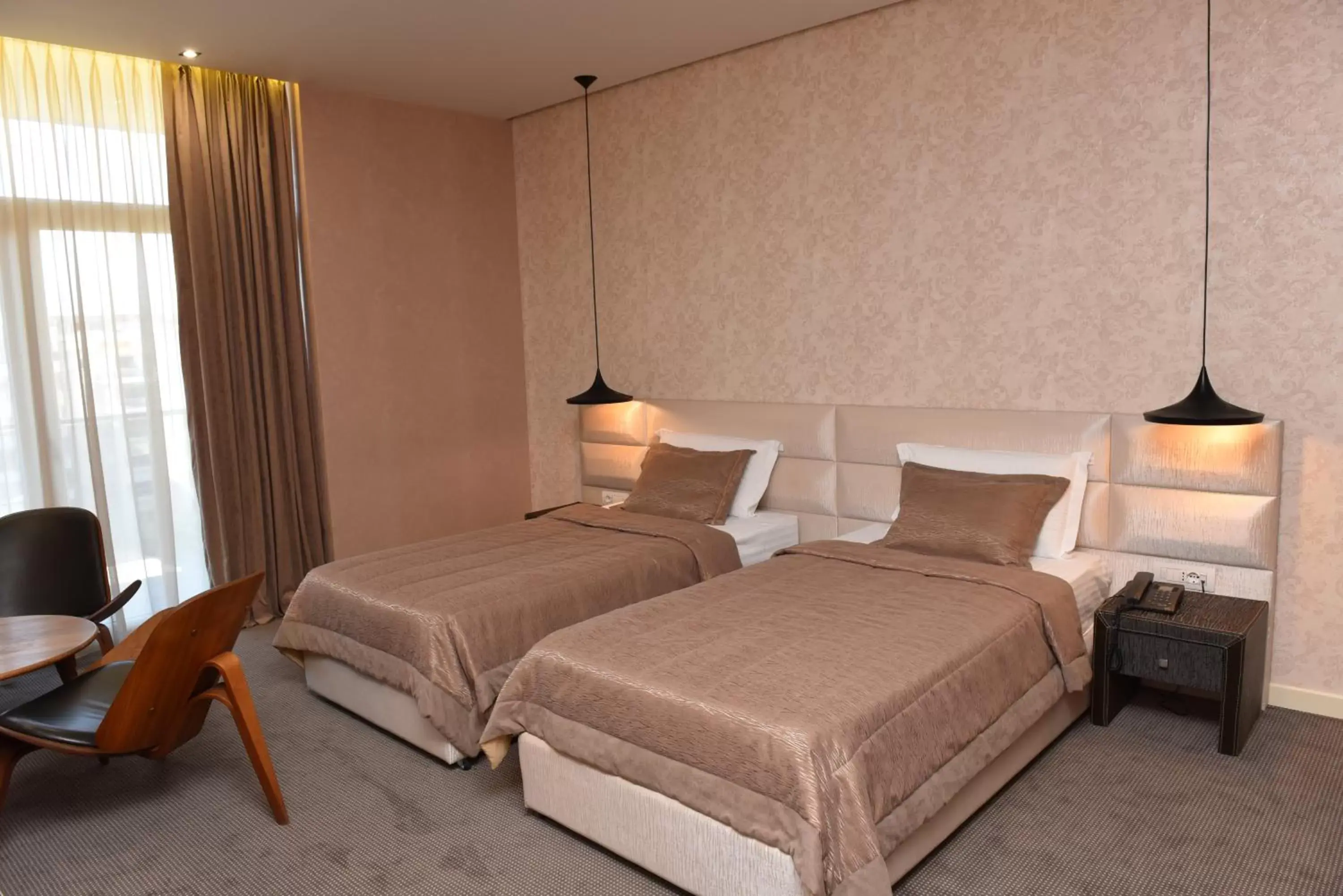 Bed in La Bohème Hotel