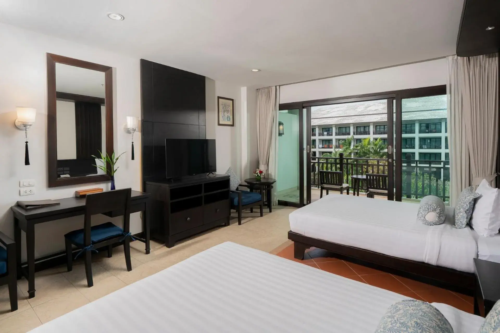 Bed, TV/Entertainment Center in Ravindra Beach Resort & Spa - SHA Extra Plus