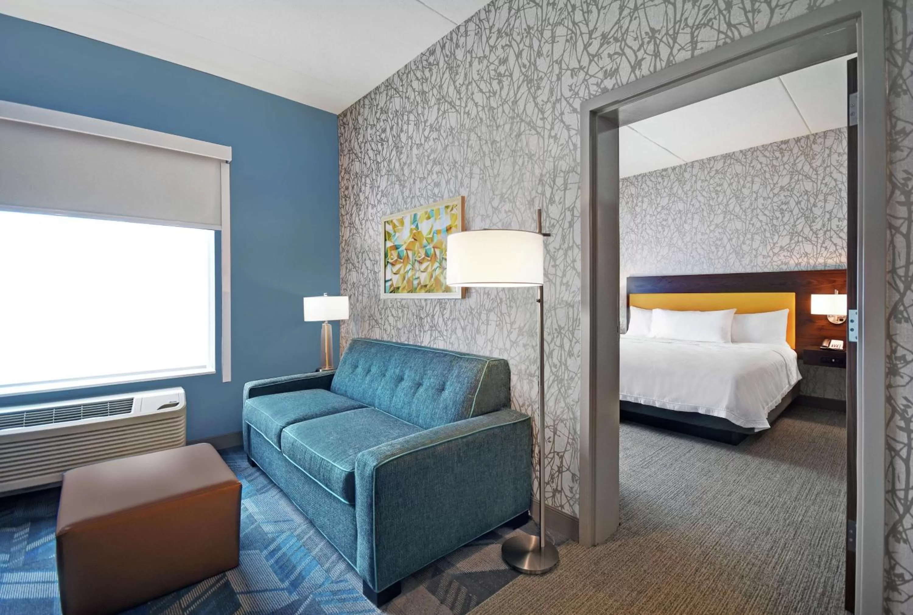 Living room, Bed in Home2 Suites By Hilton Lawrenceville Atlanta Sugarloaf, Ga