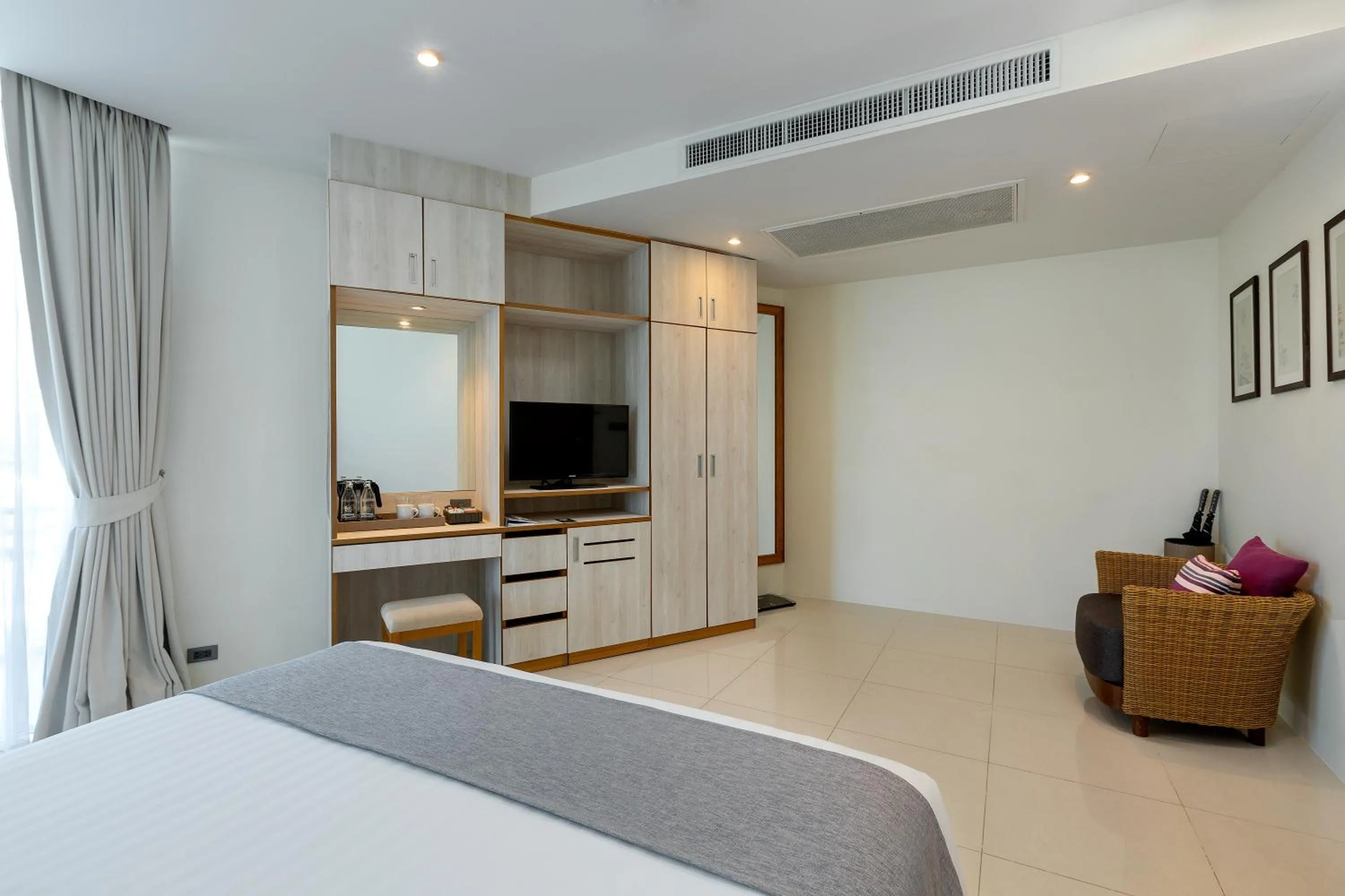 Photo of the whole room, Bed in Splash Beach Resort Phuket Family-Friendly Water Park Resort Near Phuket Airport