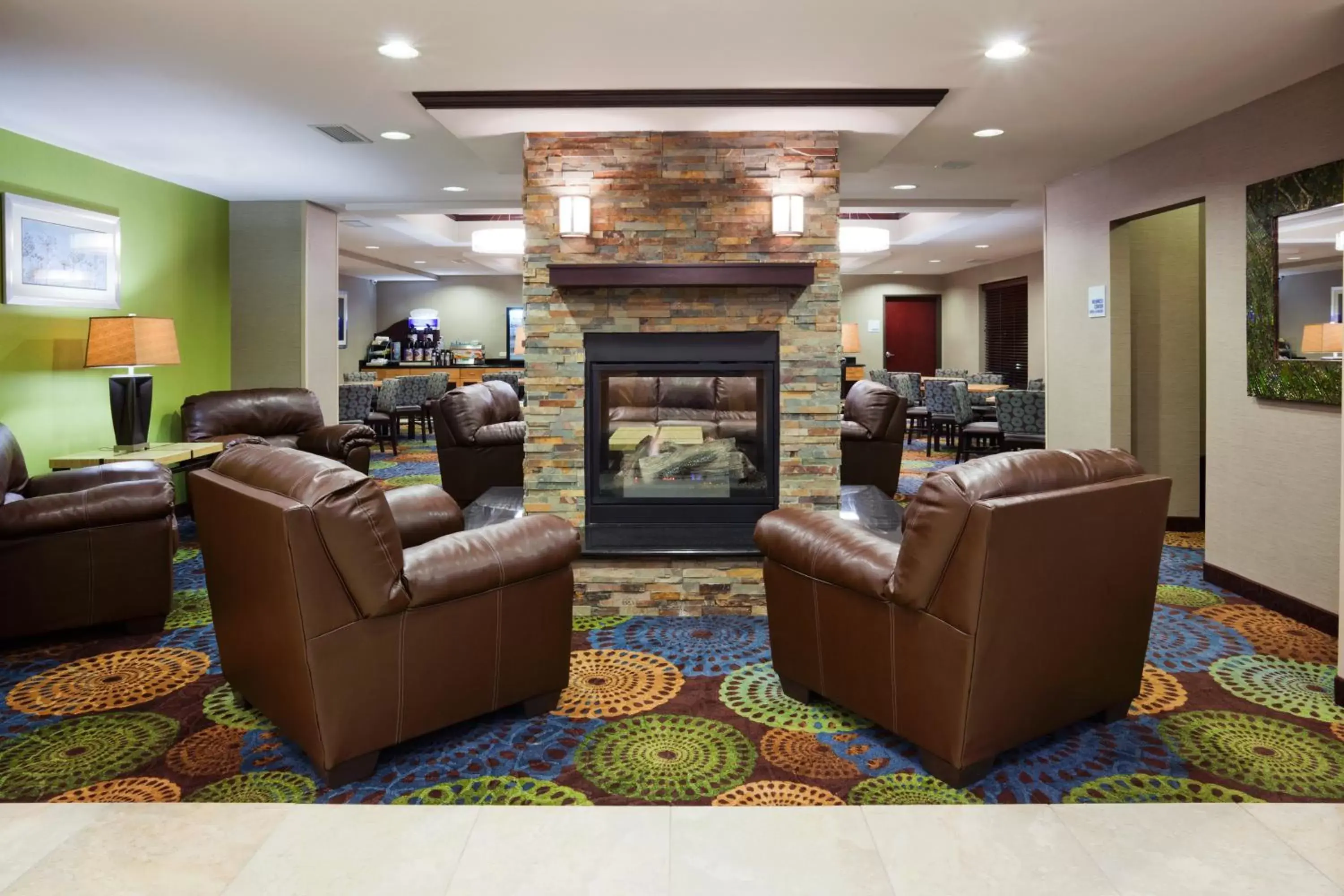 Seating area, Lobby/Reception in Holiday Inn Express and Suites Rochester West-Medical Center, an IHG Hotel