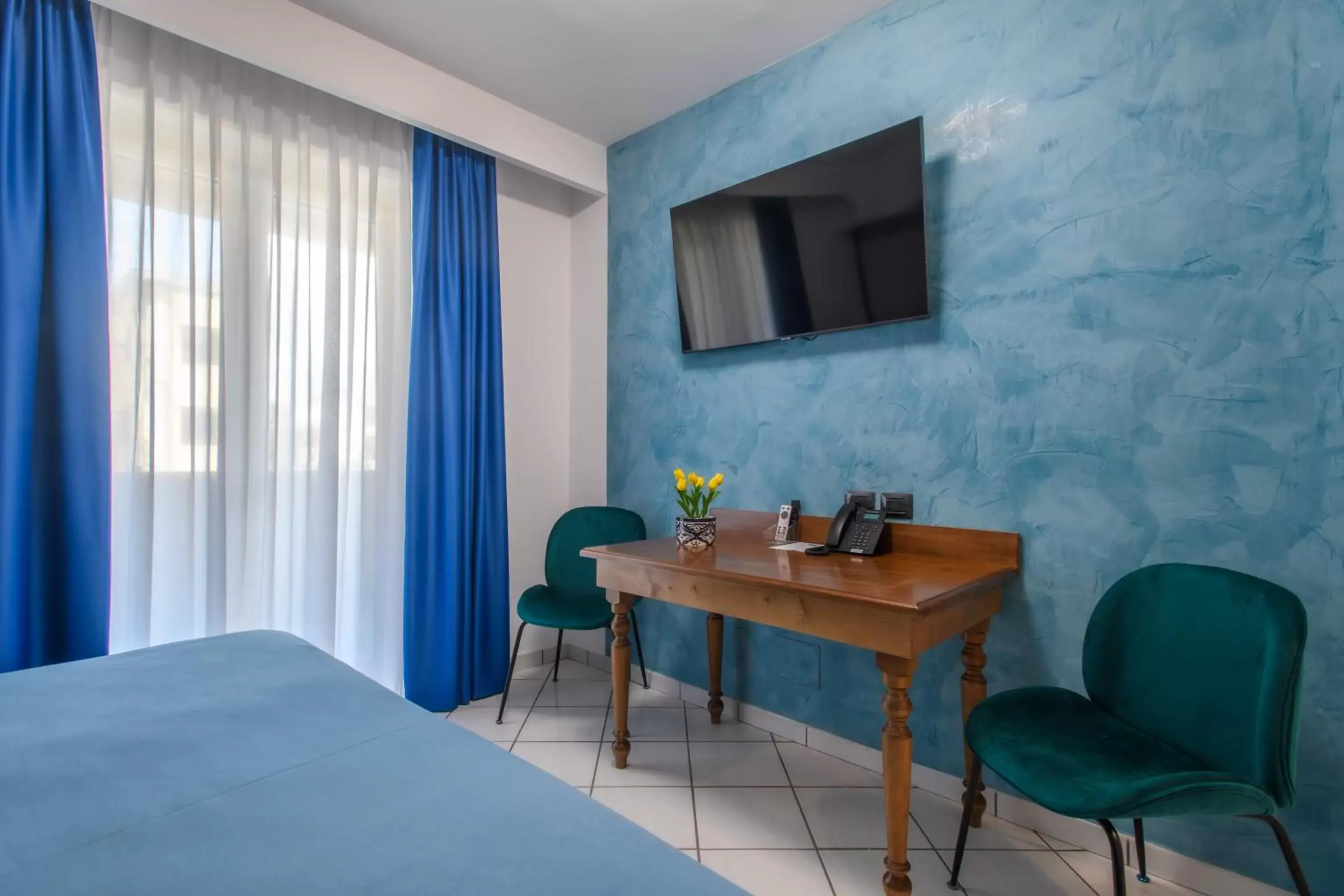 Bed, TV/Entertainment Center in Hotel Ancora