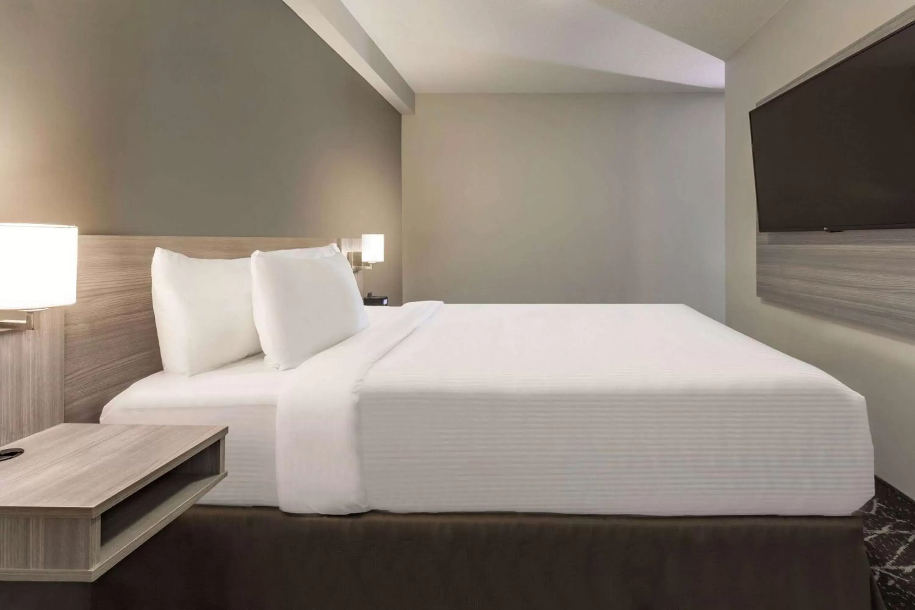 Bed in Microtel Inn & Suites by Wyndham Lloydminster