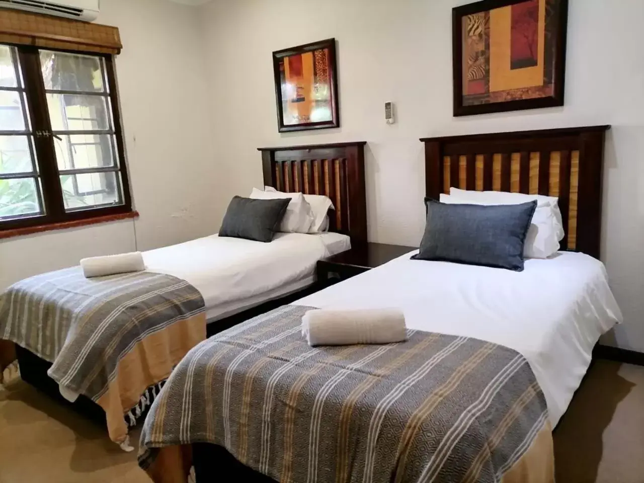 Bed in Hotel Numbi & Garden Suites