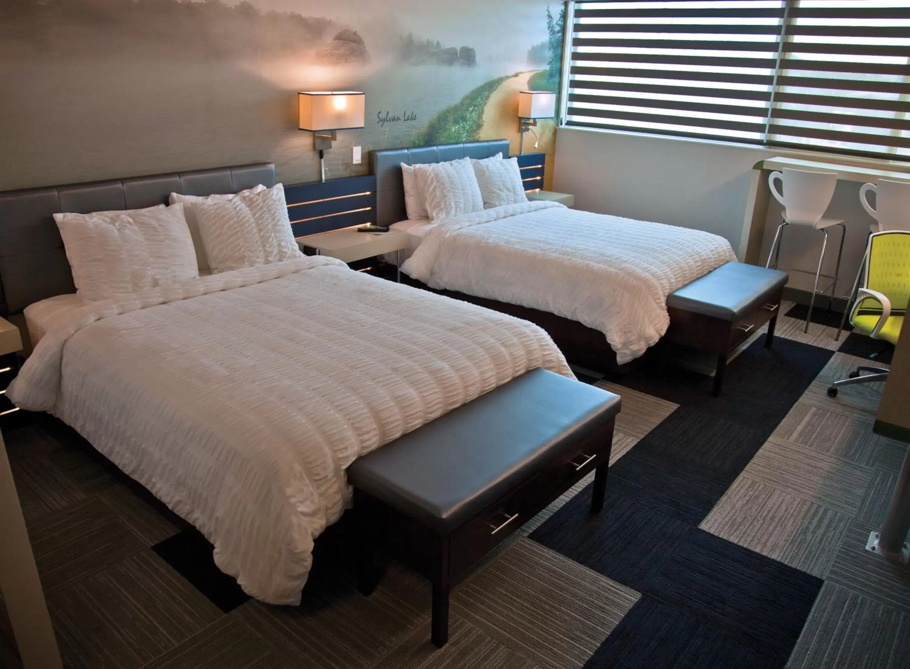 Bed in The Rushmore Hotel & Suites; BW Premier Collection