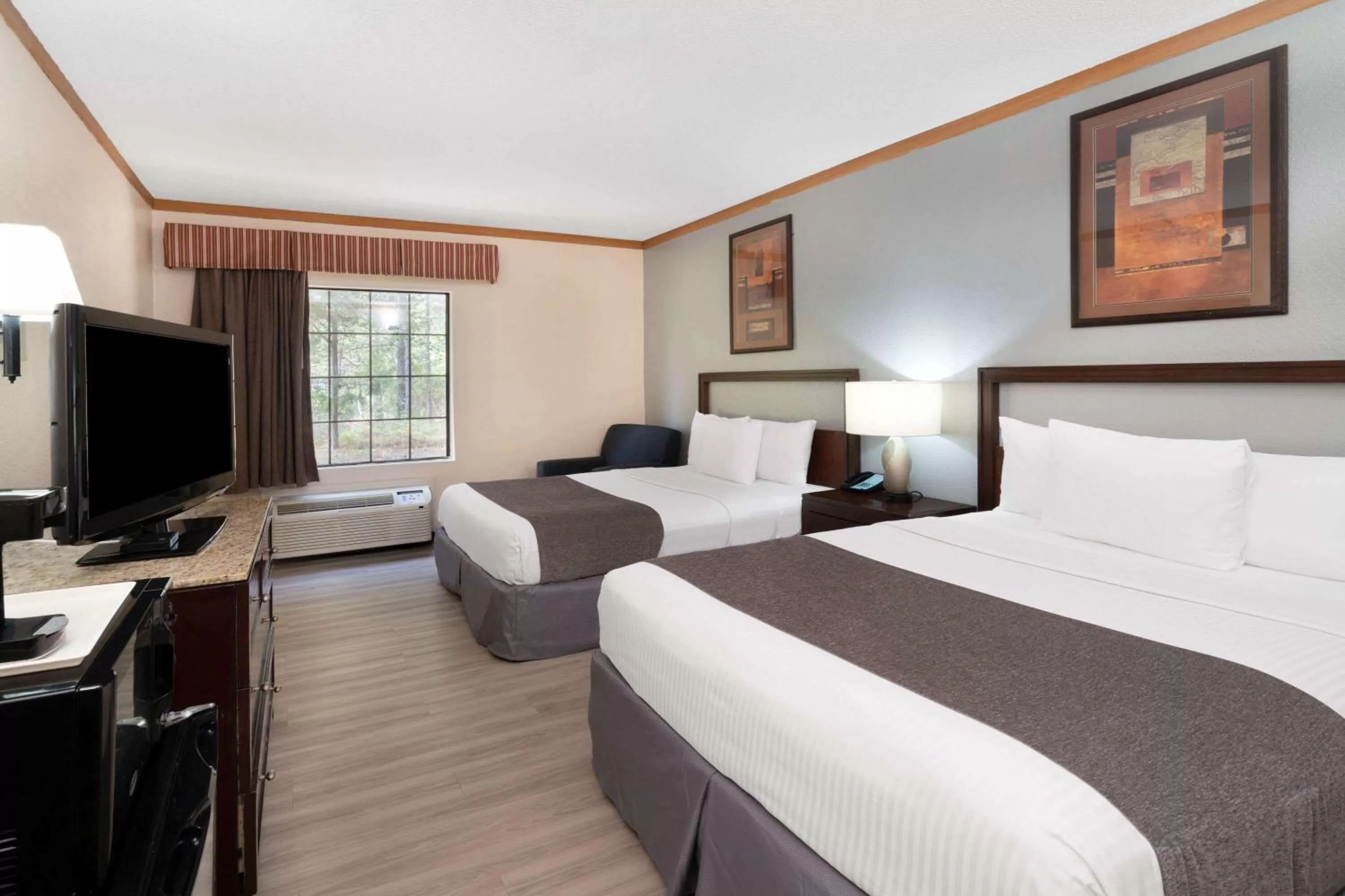 Photo of the whole room, Bed in Baymont by Wyndham Hinesville Fort Stewart Area