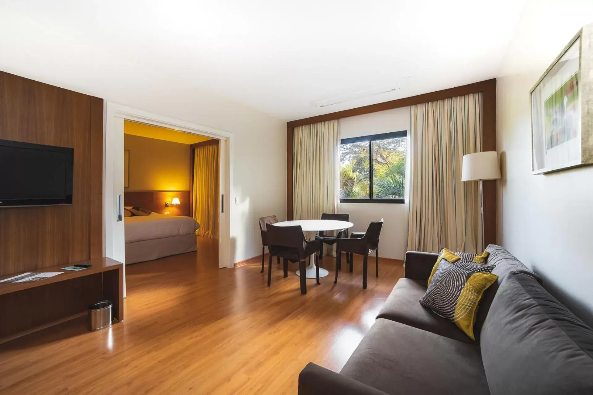 Bed, Seating Area in Novotel Campo Grande