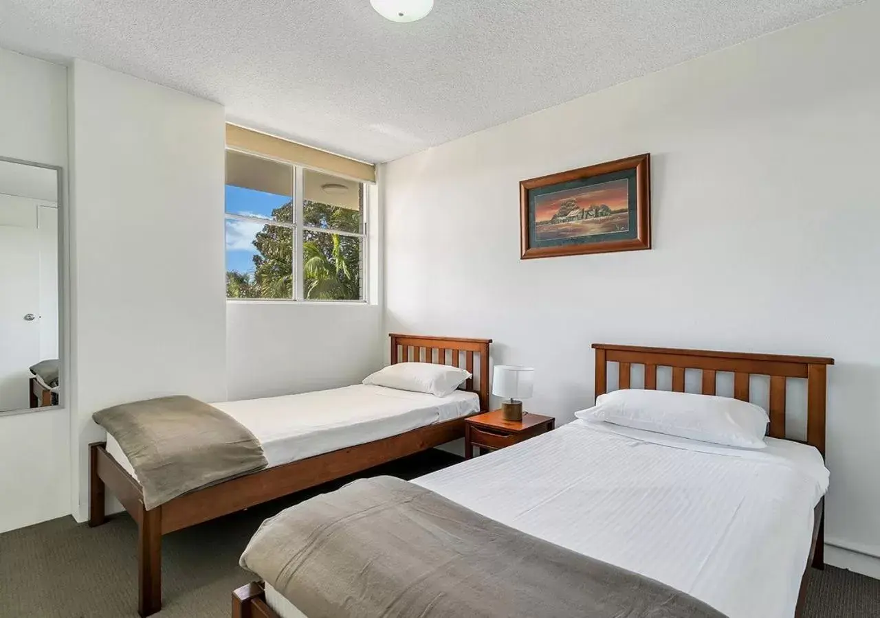 Bed in Tradewinds Apartments