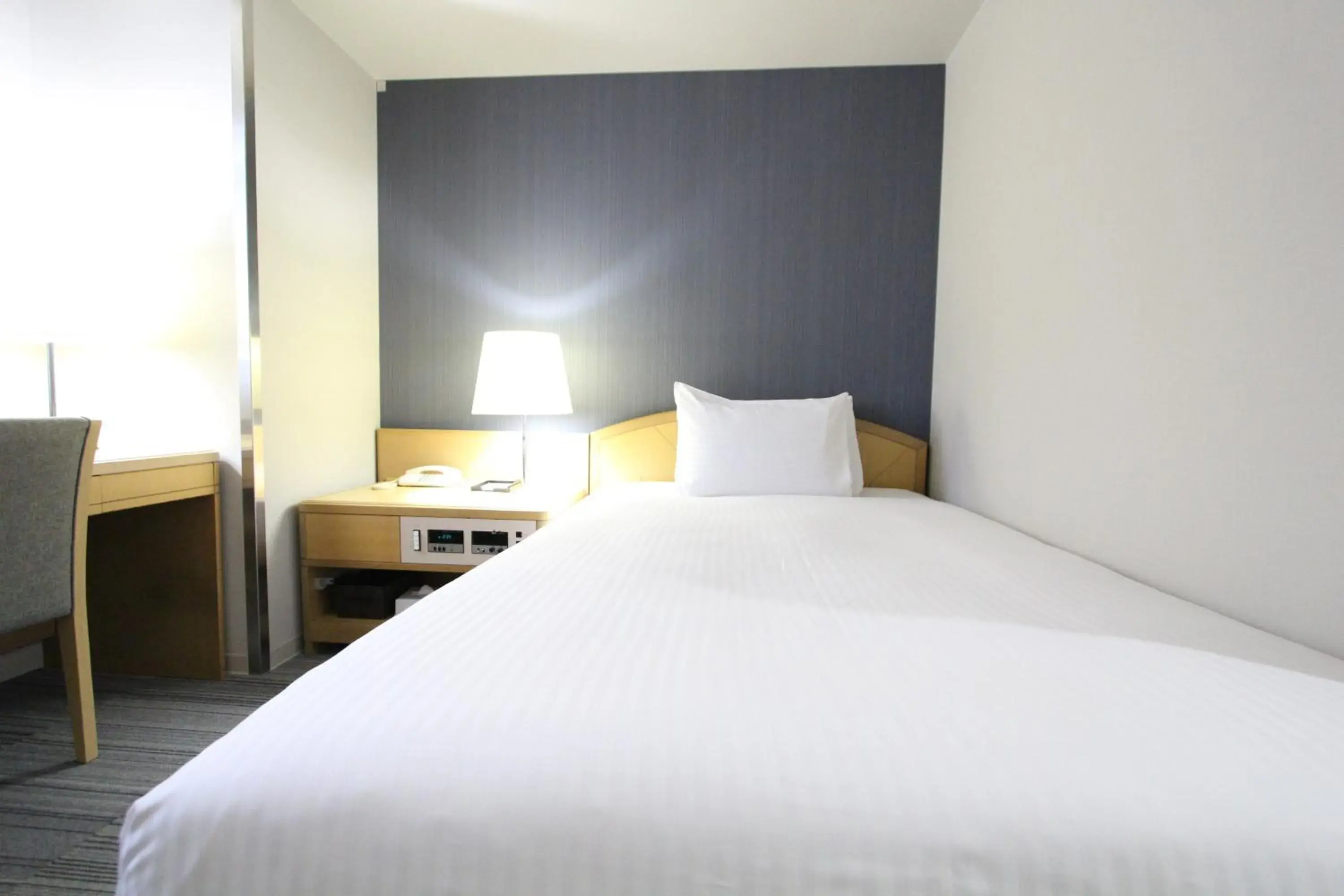 Bed in SureStay Plus Hotel by Best Western Shin-Osaka