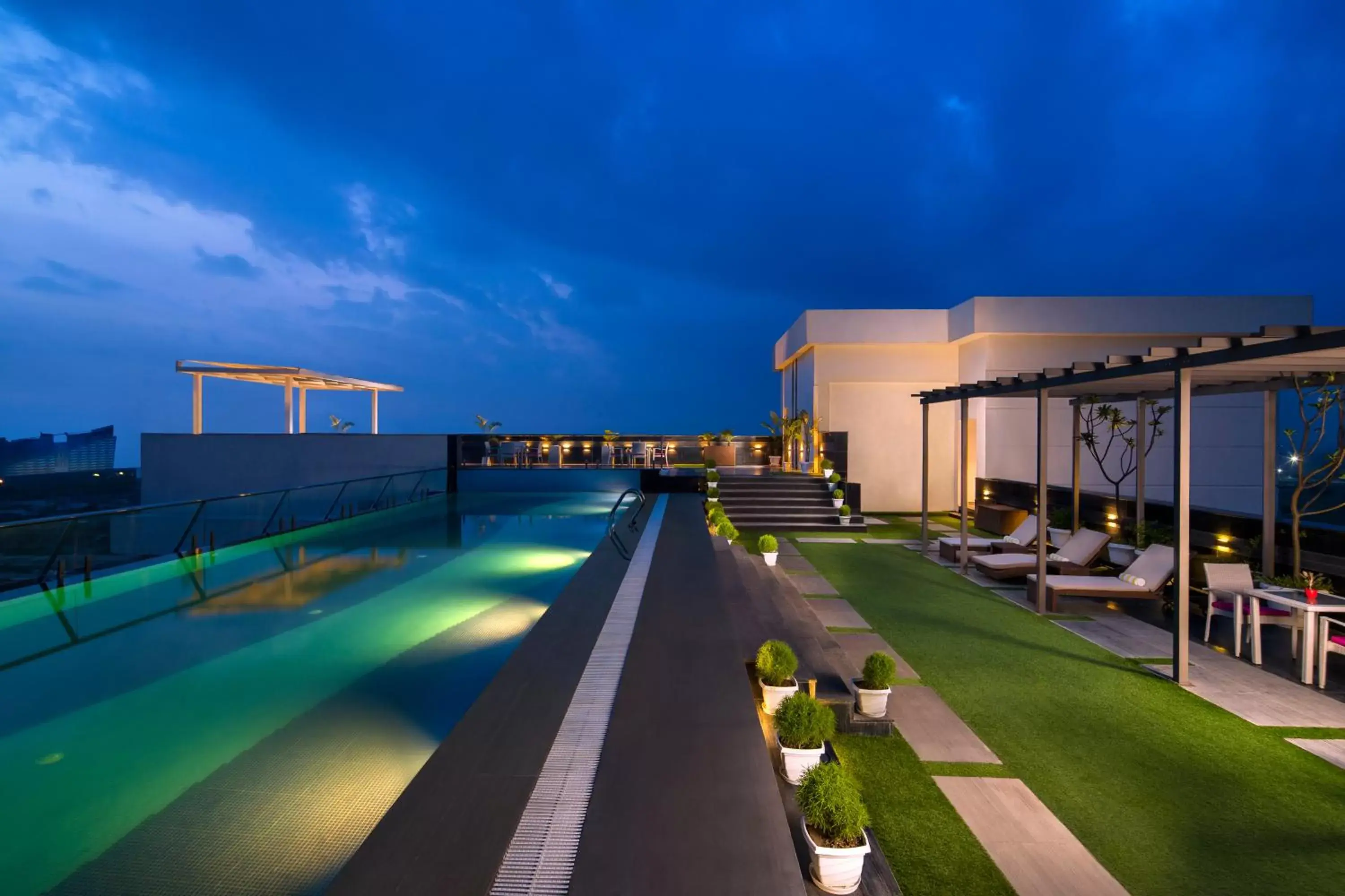 Swimming pool in Sandal Suites by Lemon Tree Hotels Swimming pool in Sandal Suites by Lemon Tree Hotels