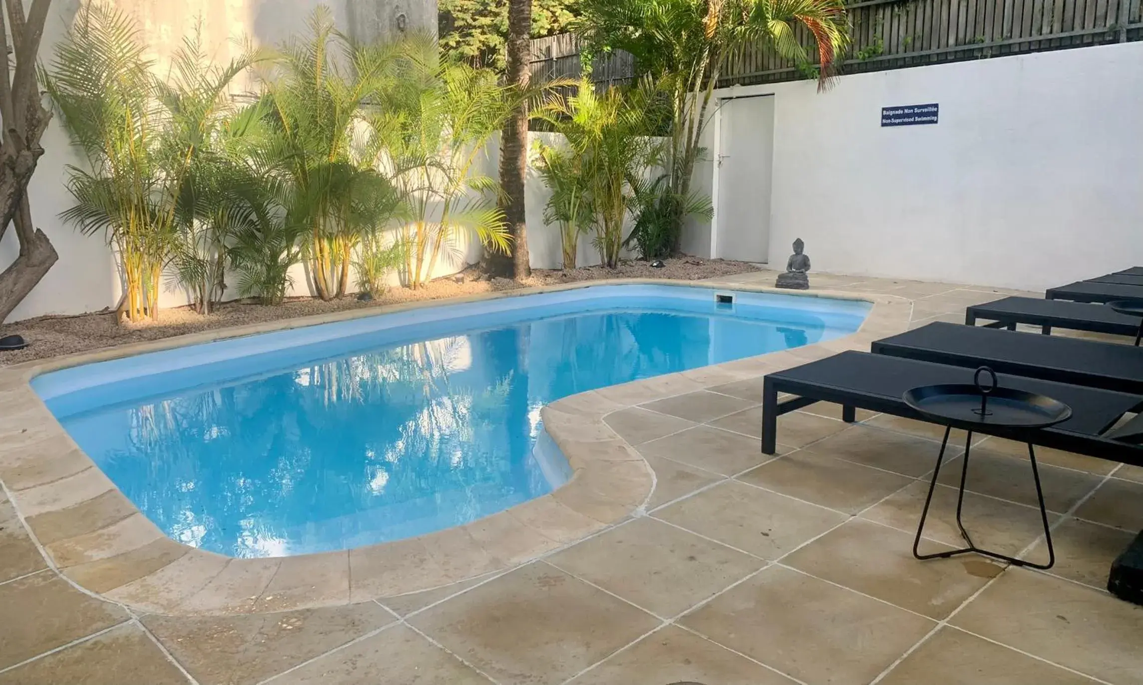 Swimming Pool in Sous Le Badamier Guest House Restaurant Bar