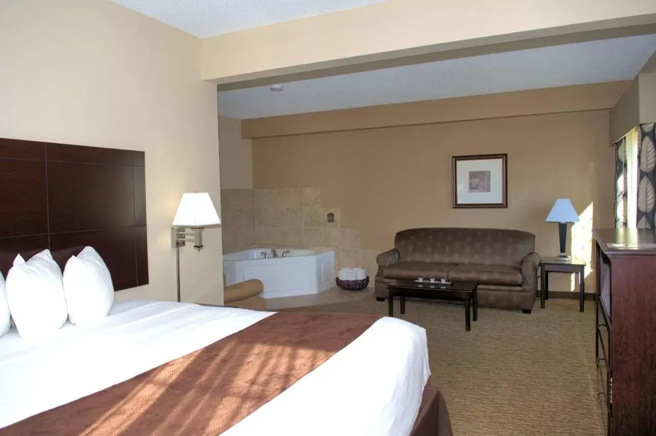 Bed in Rock Island Inn & Suites