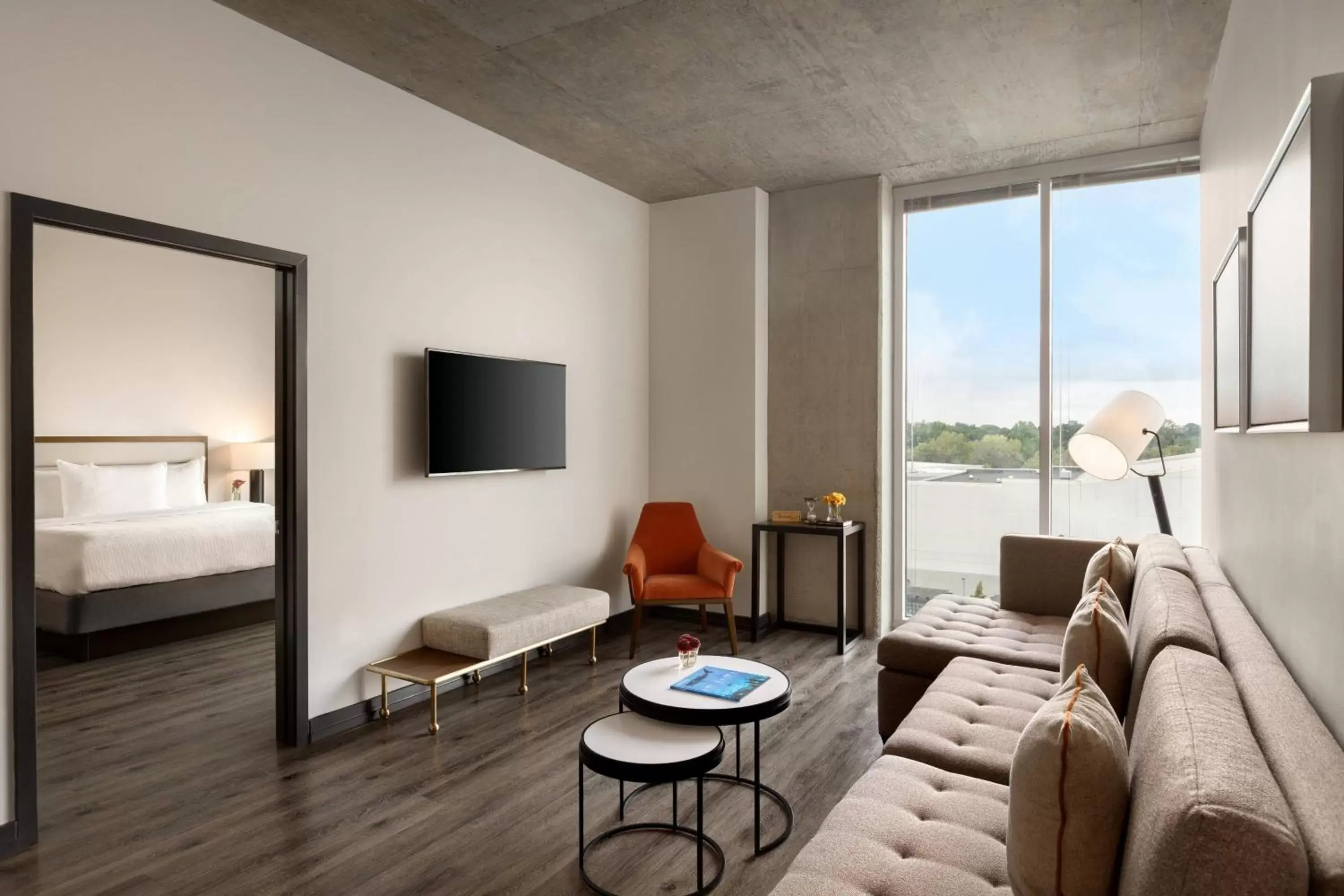 Living room, Bed in Twelve Midtown, Autograph Collection Living room, Bed in Twelve Midtown, Autograph Collection