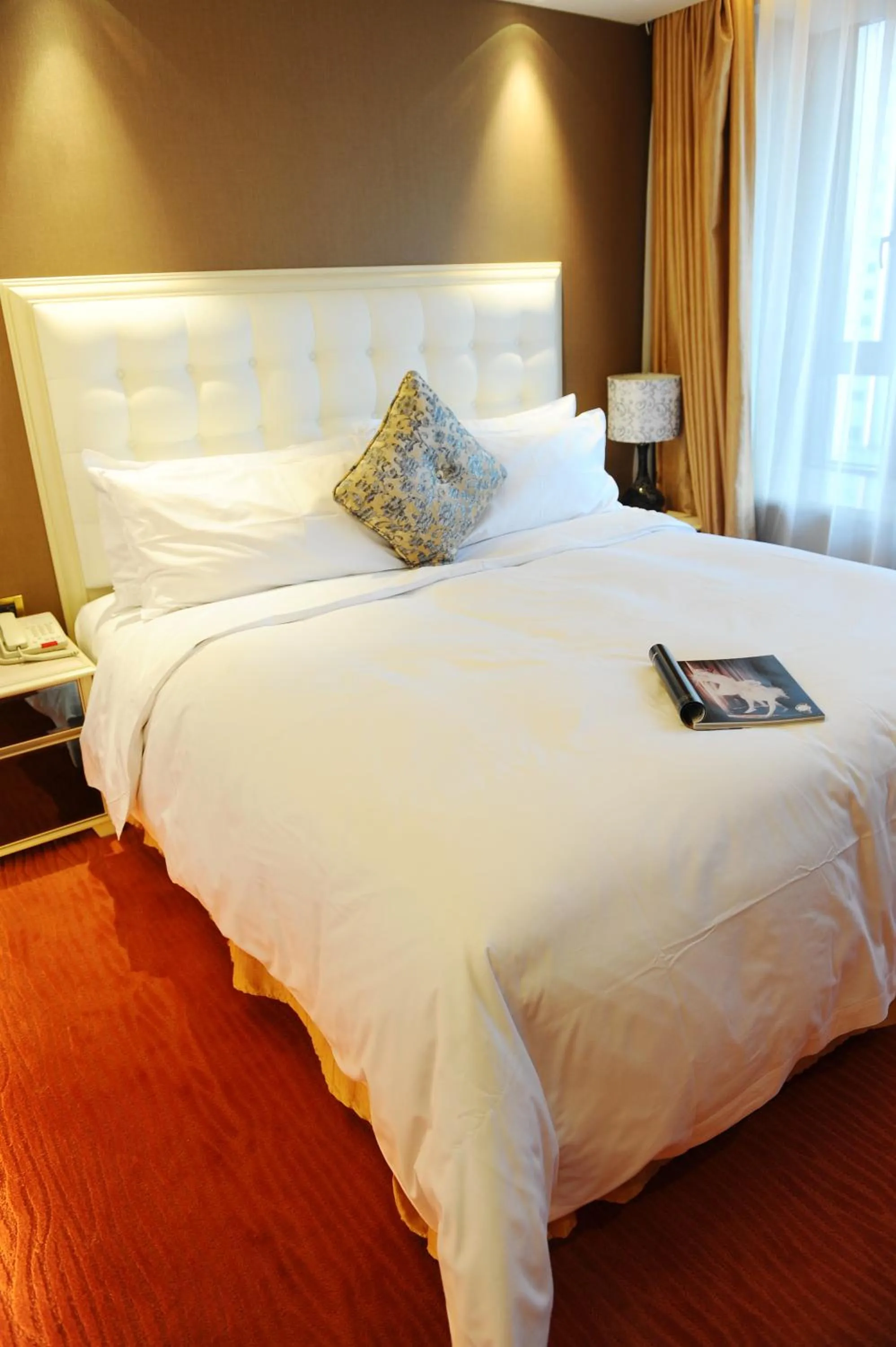 Bed in Wealthy All Suite Hotel Suzhou