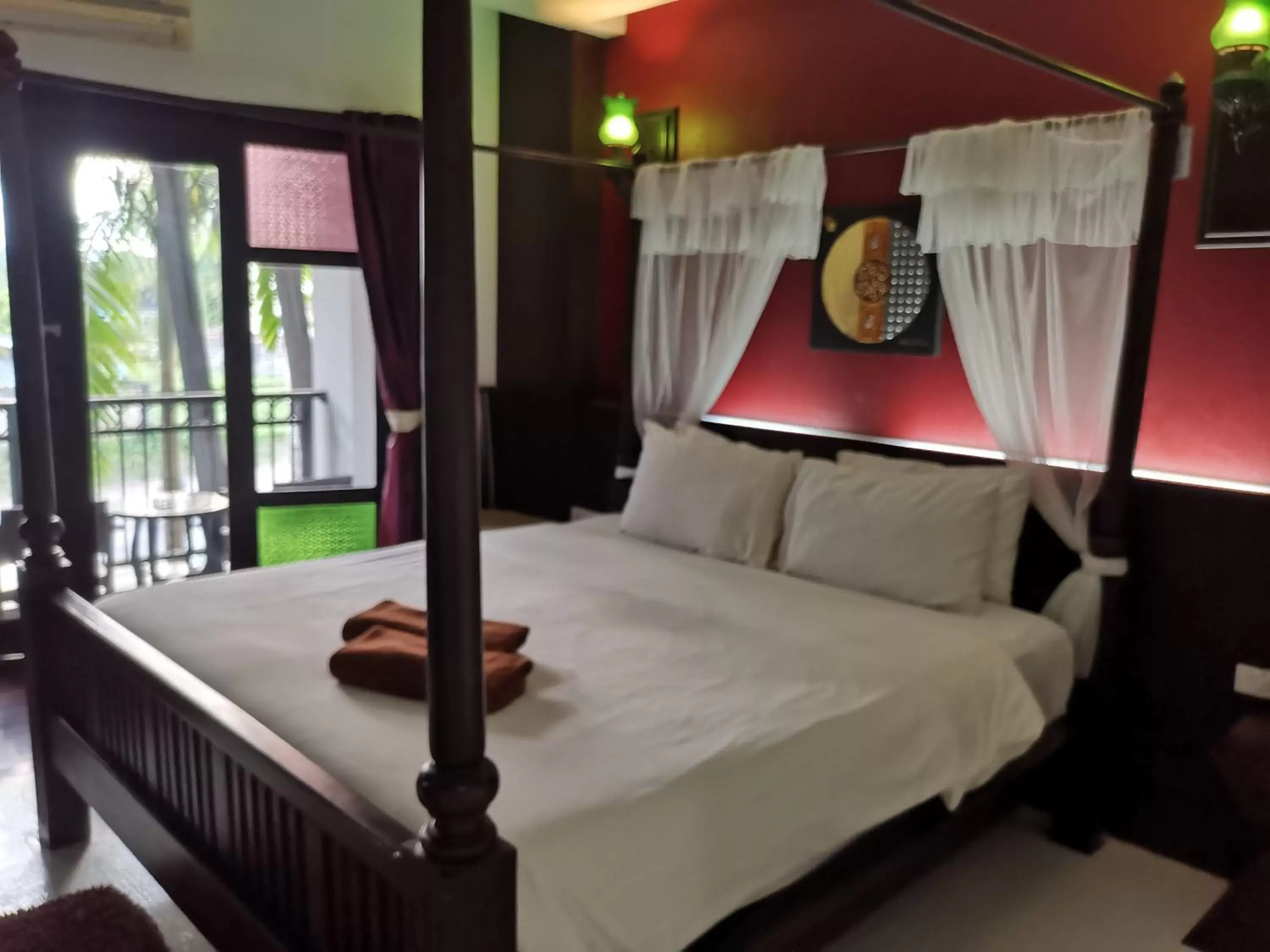 Bed in Dee Andaman Hotel