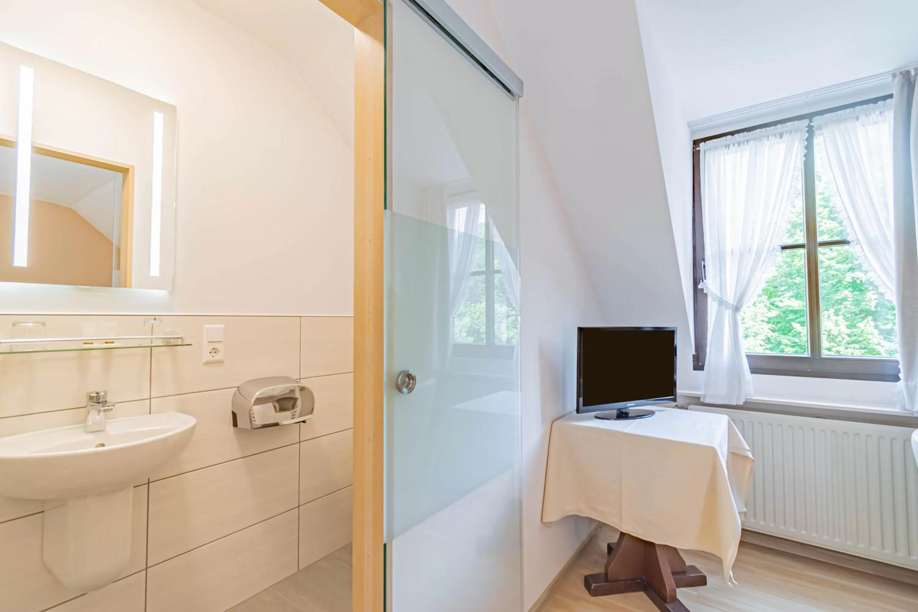 Bathroom in Hotel Le Postillon