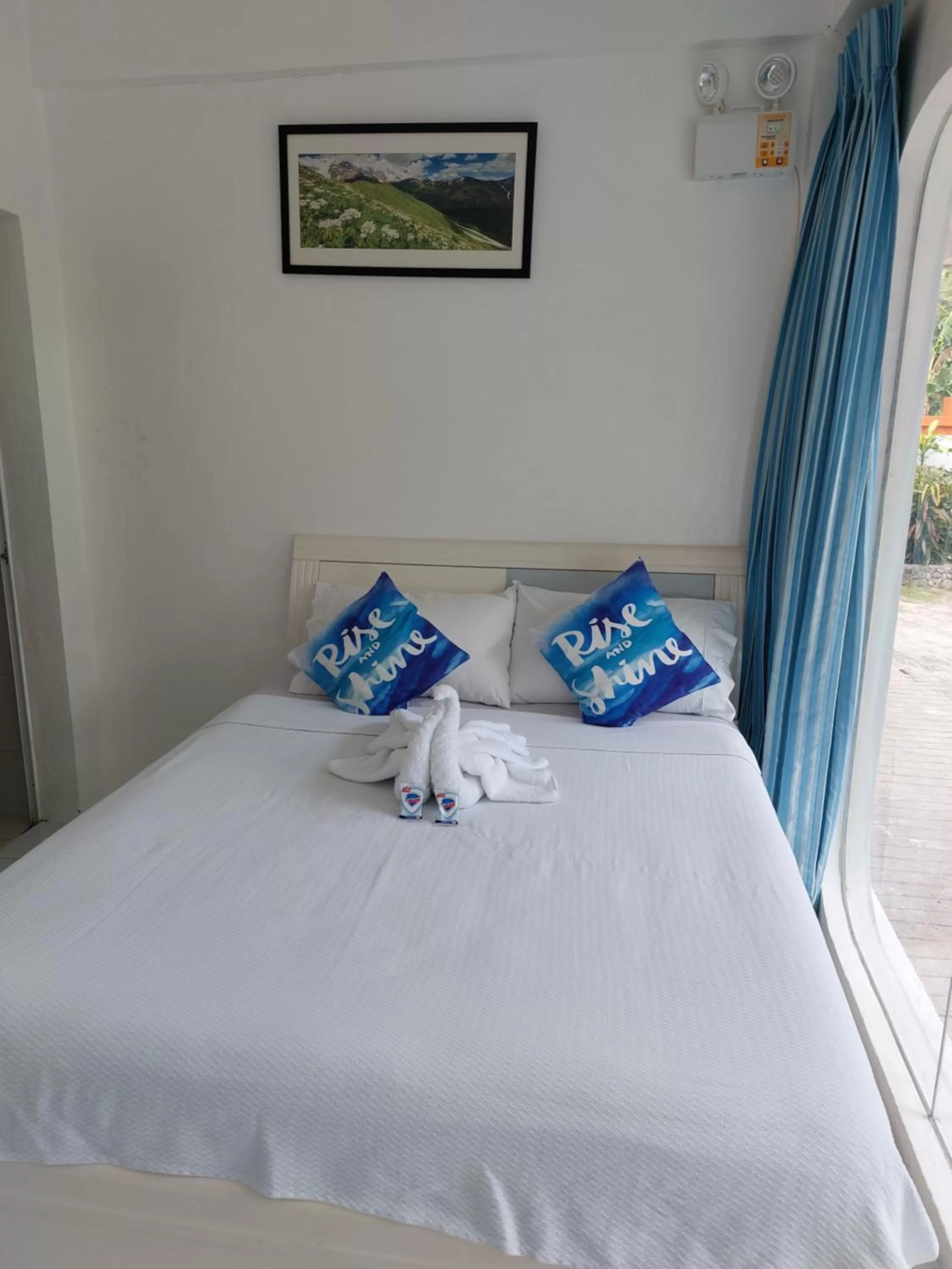 Bed in RRJ's BEACH RESORT