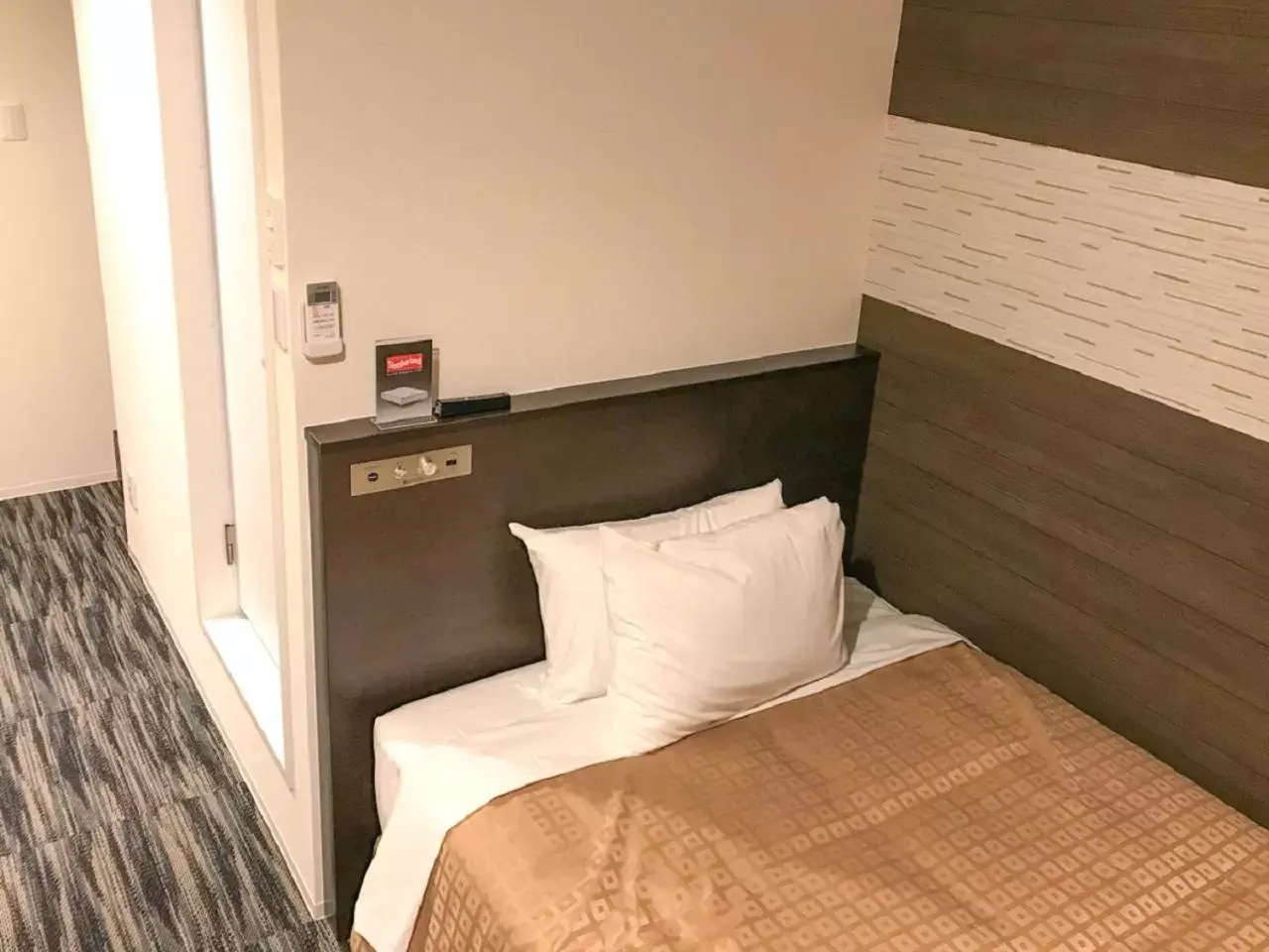 Bed in HOTEL LiVEMAX Takamatsu Eki Mae