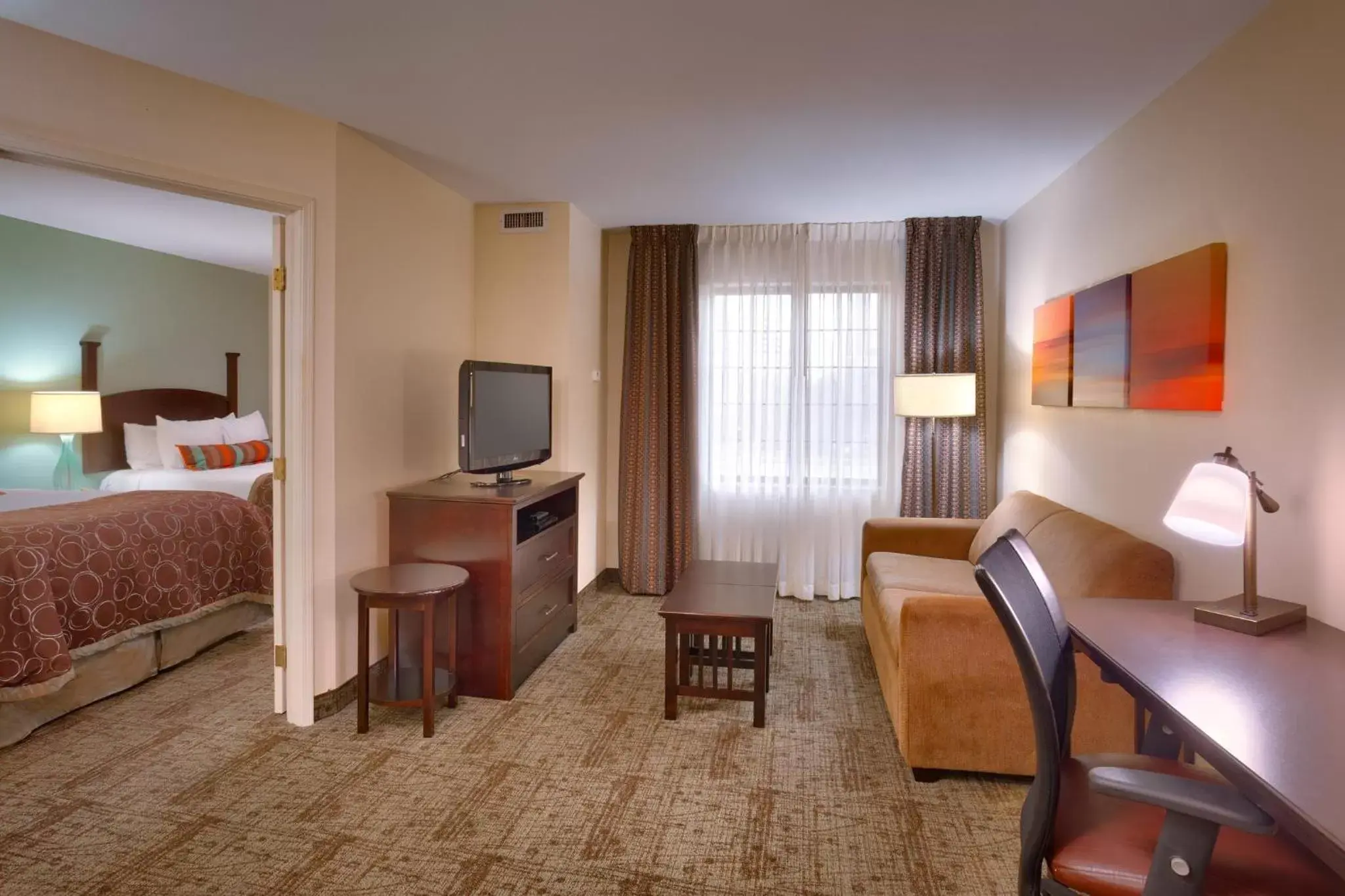 Photo of the whole room, TV/Entertainment Center in Staybridge Suites Peoria Downtown, an IHG Hotel