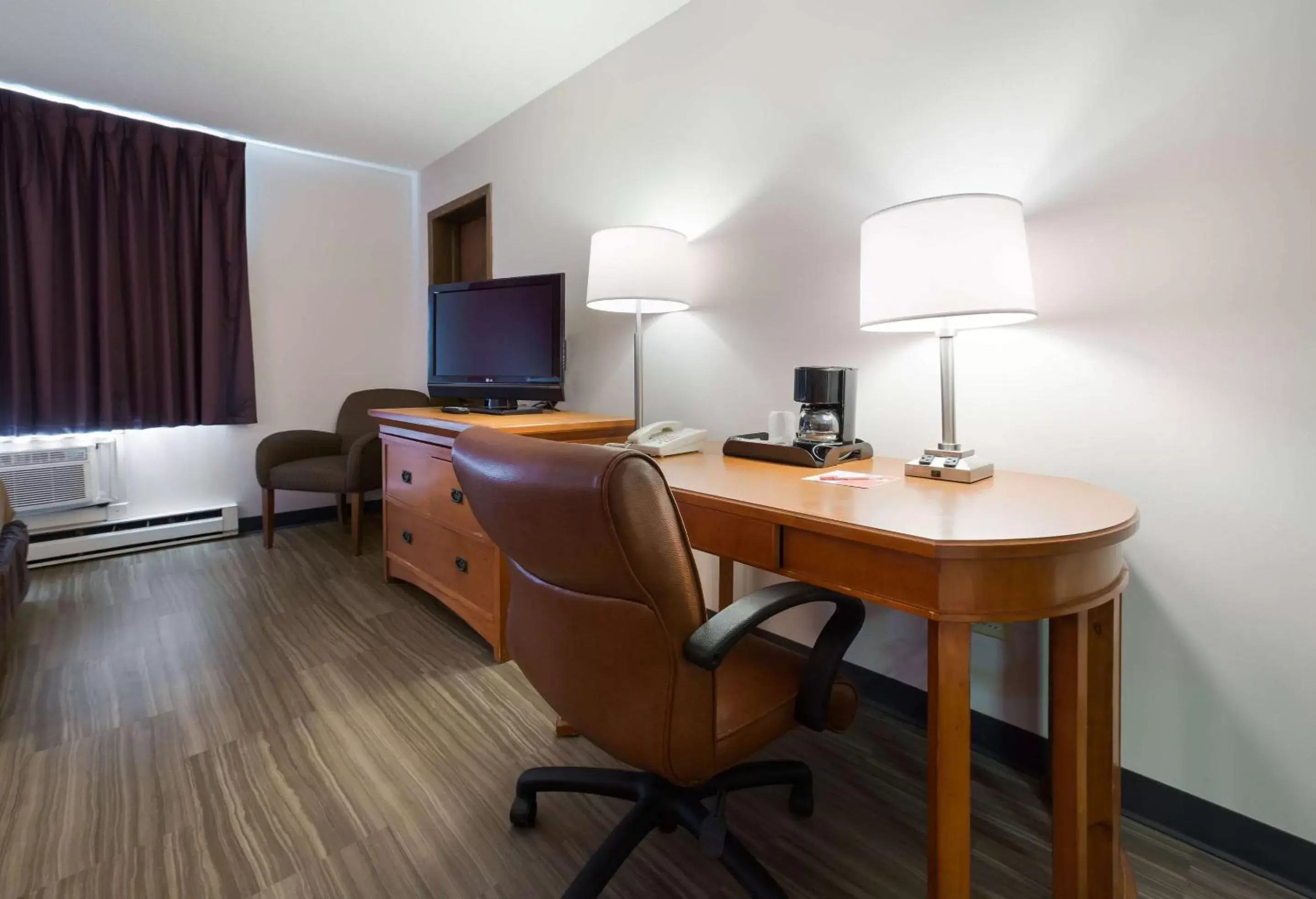 Photo of the whole room, TV/Entertainment Center in Econo Lodge Inn & Suites