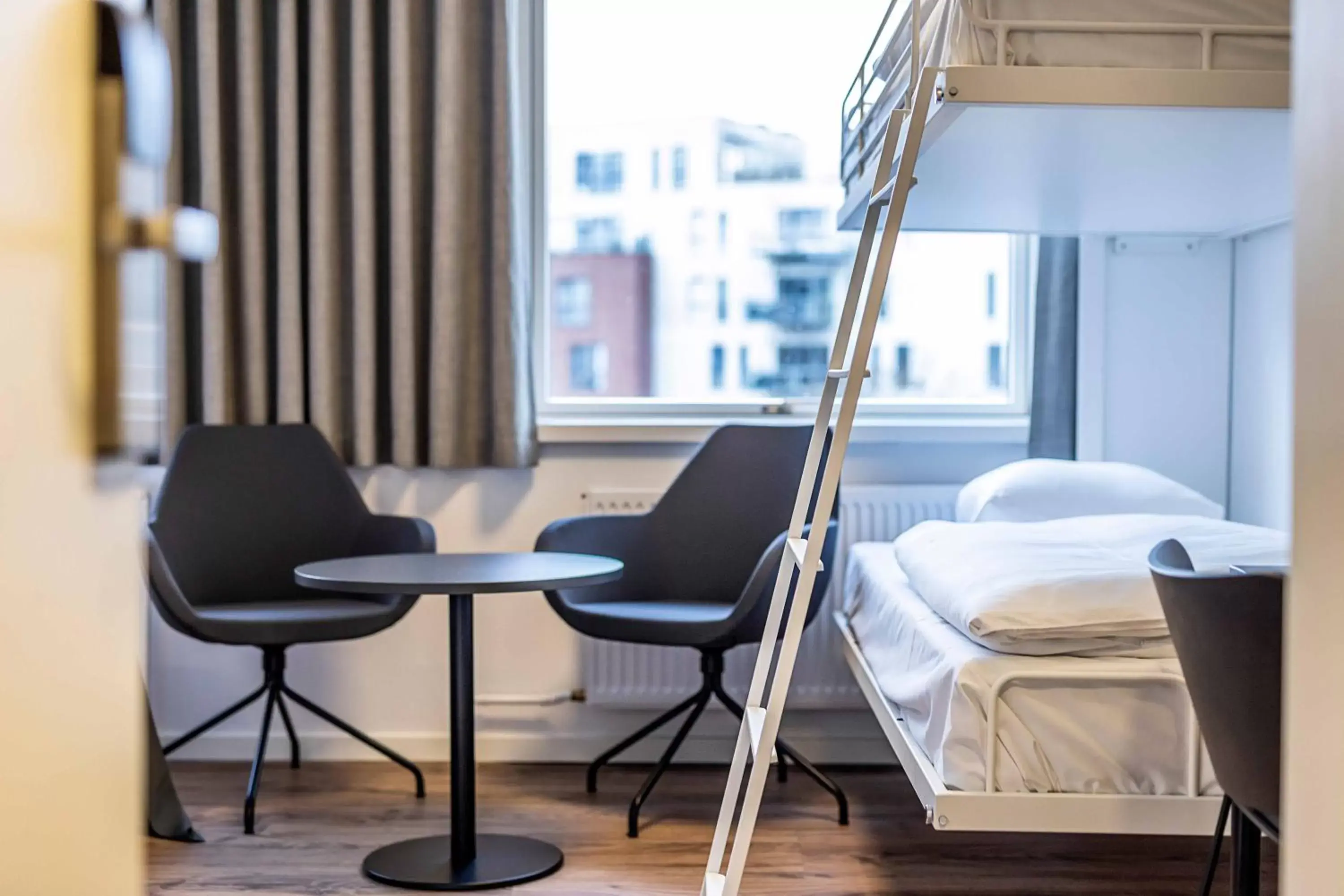 Bed, Seating Area in KOMPAS Hotel Aalborg