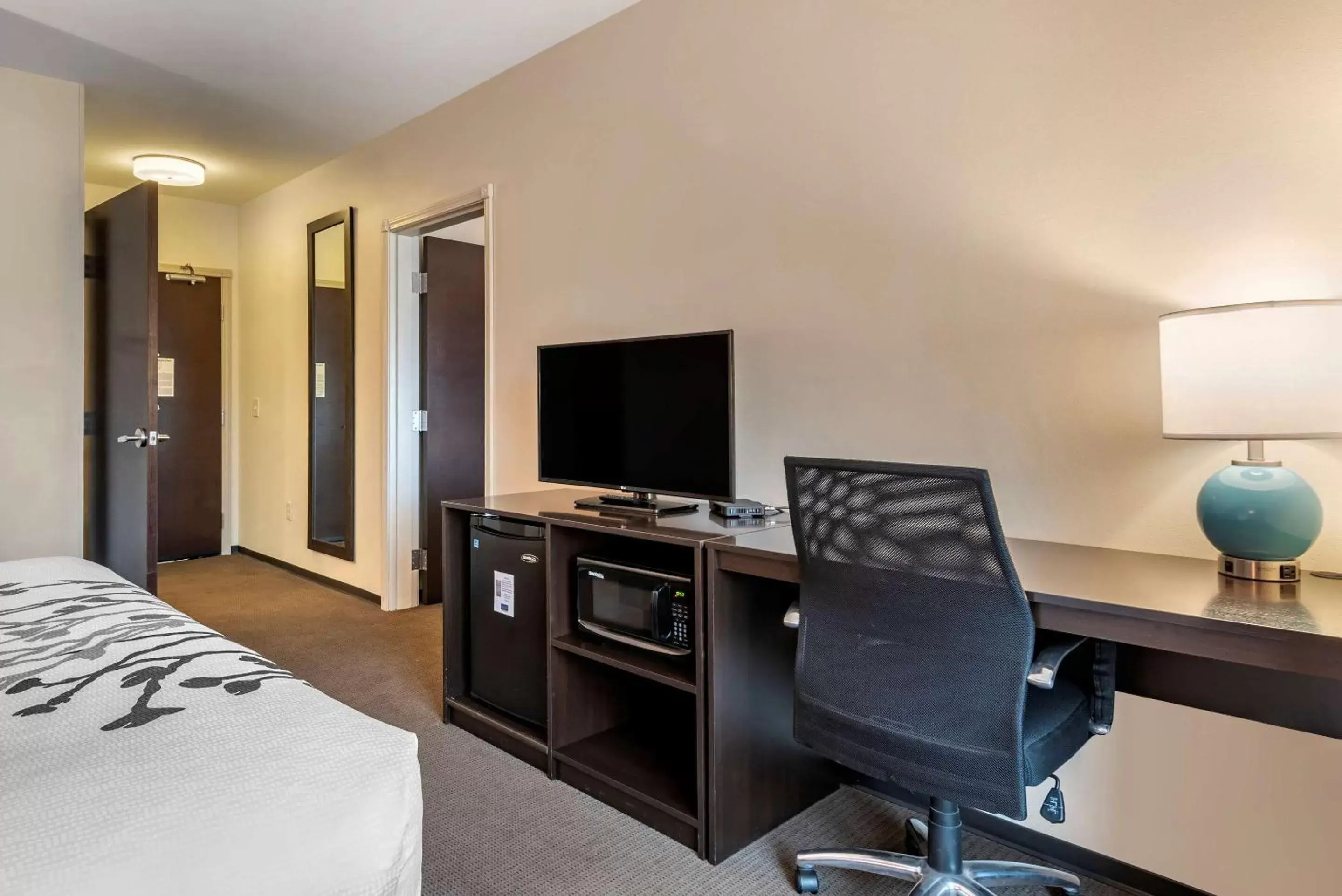 Photo of the whole room, TV/Entertainment Center in Sleep Inn & Suites Moab near Arches National Park