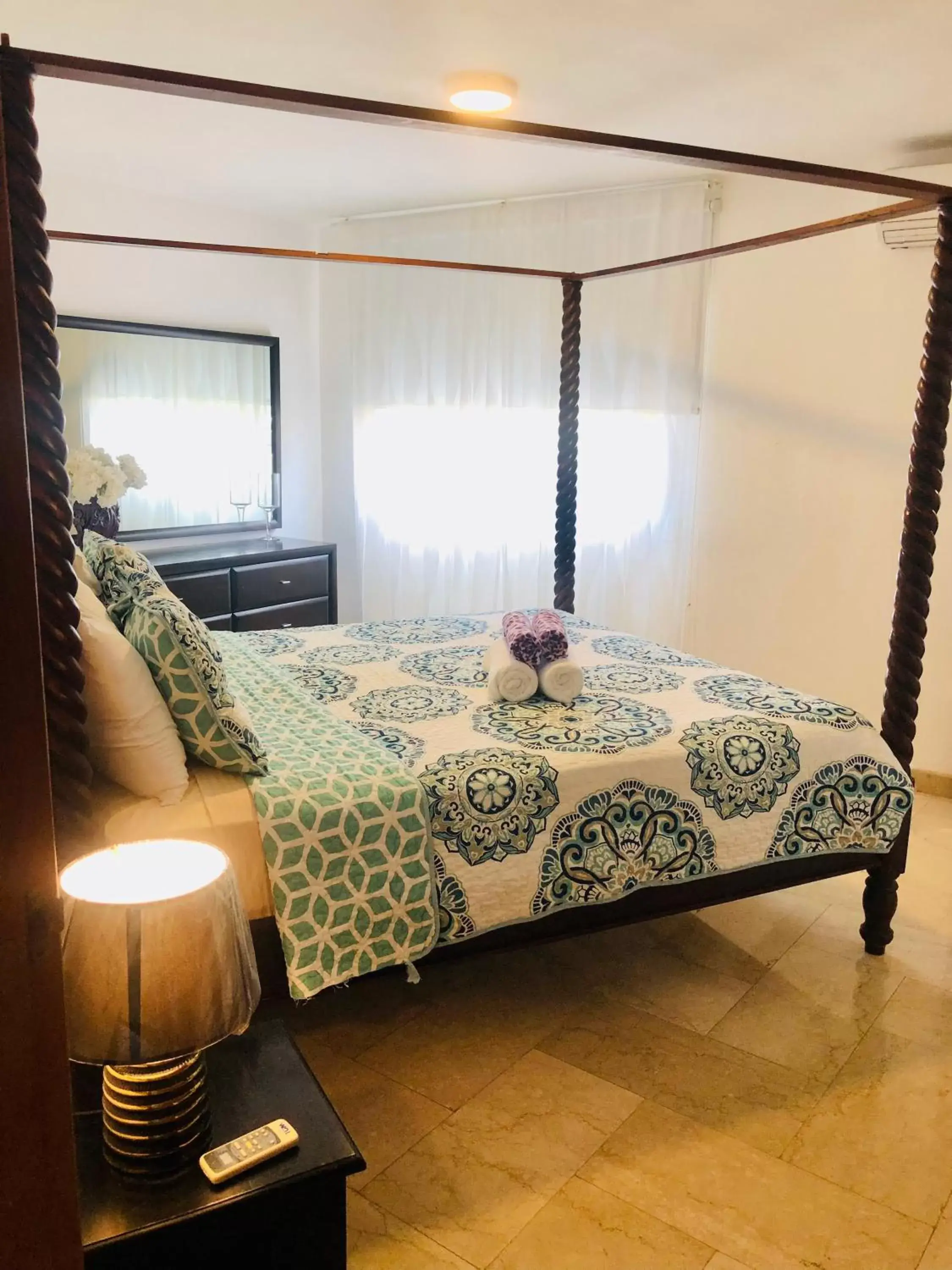 Bed in Los Corales Luxury Villas Beach Club and Spa