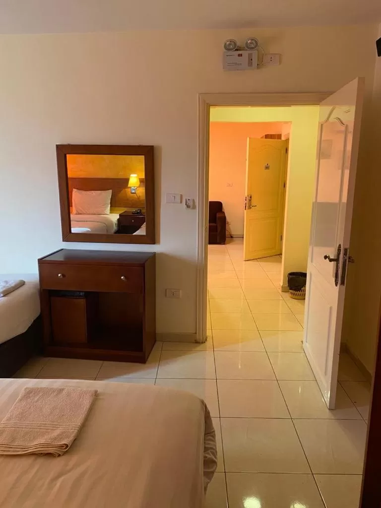 Bed in Zaina Plaza Hotel