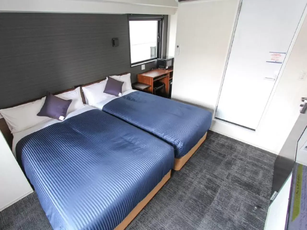 Bed in HOTEL LiVEMAX Umeda WEST