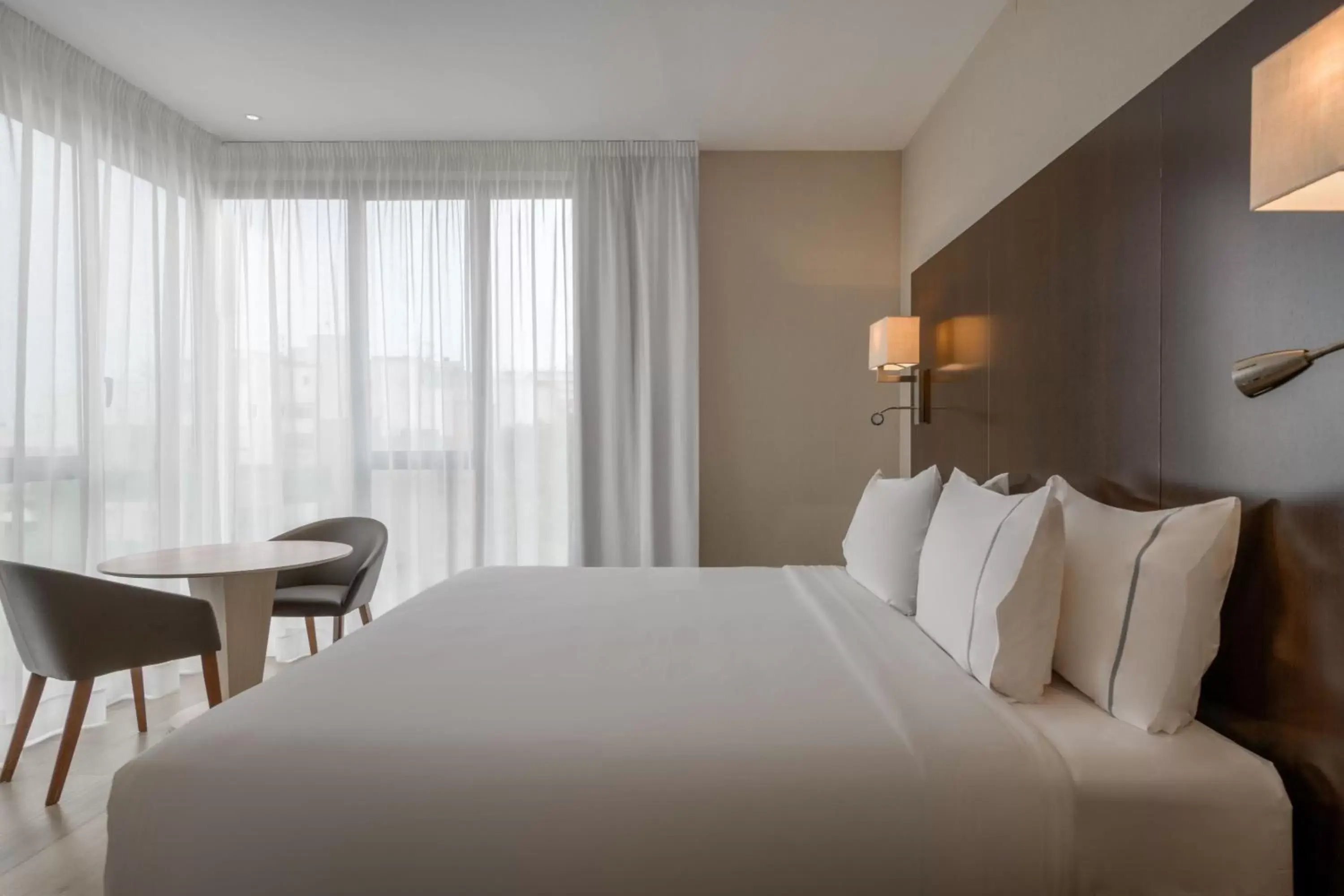 Photo of the whole room, Bed in AC Hotel Ciutat de Palma by Marriott