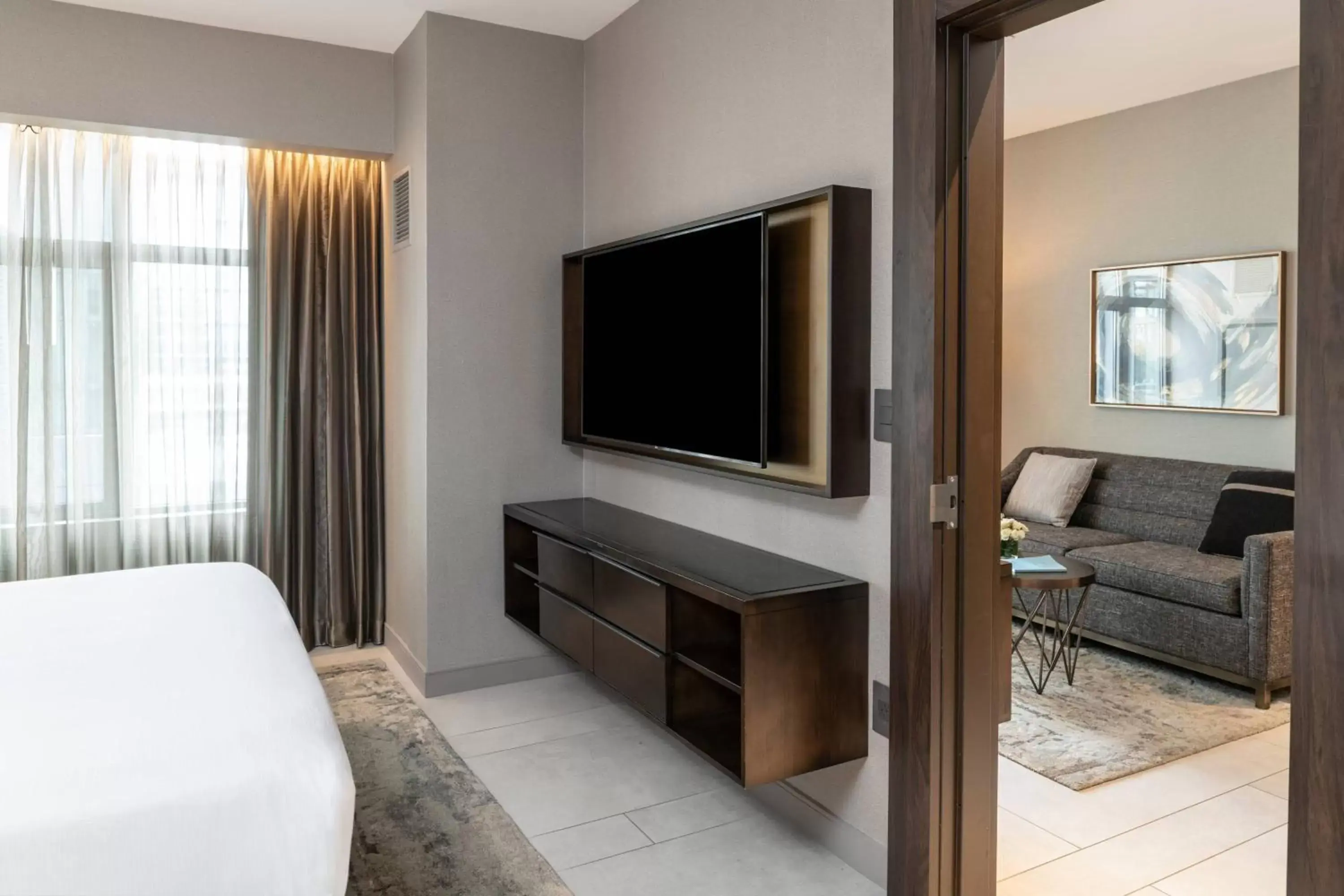 Bedroom, TV/Entertainment Center in The Row Hotel at Assembly Row, Autograph Collection by Marriott