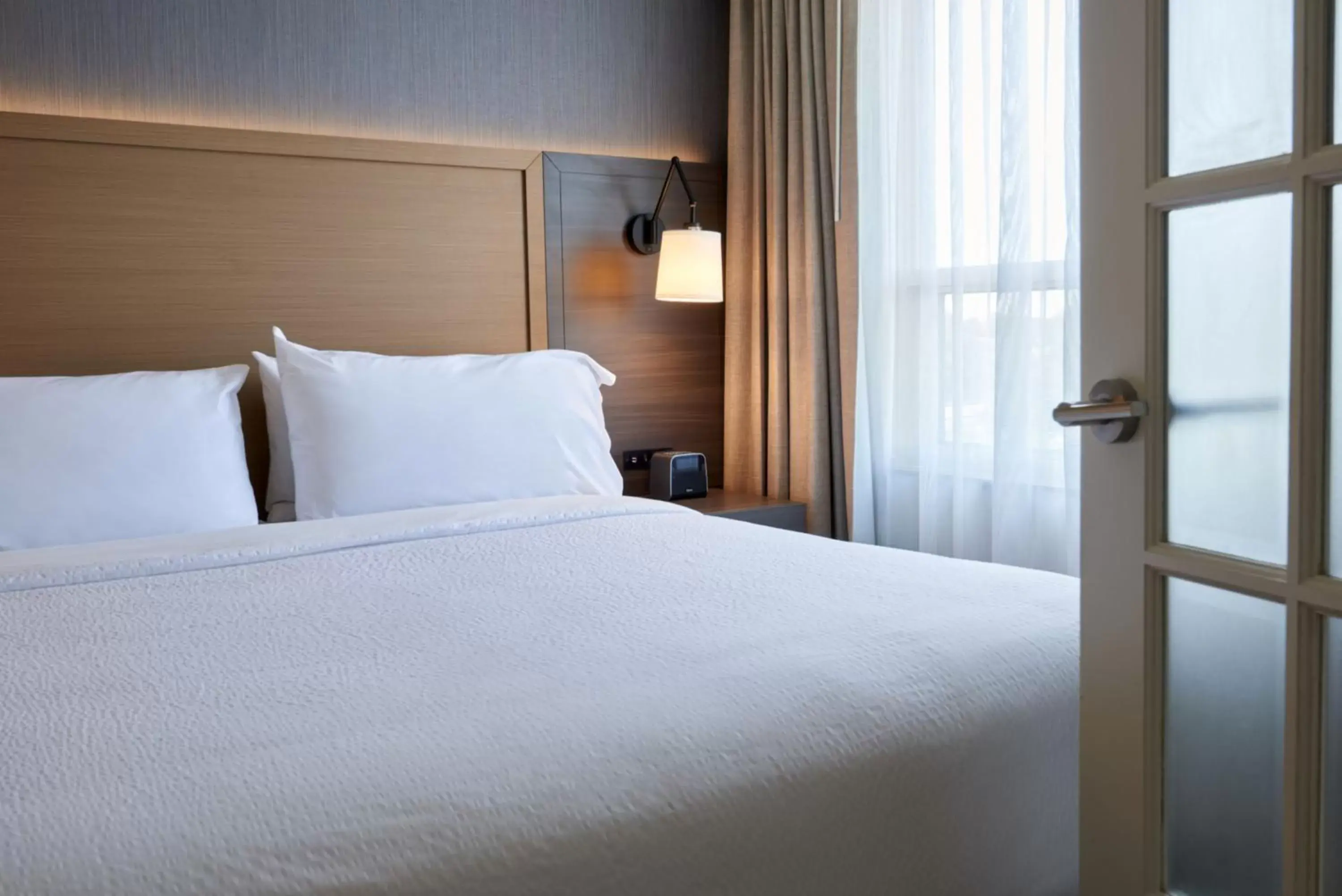 Bed in Holiday Inn & Suites Ottawa Kanata, an IHG Hotel