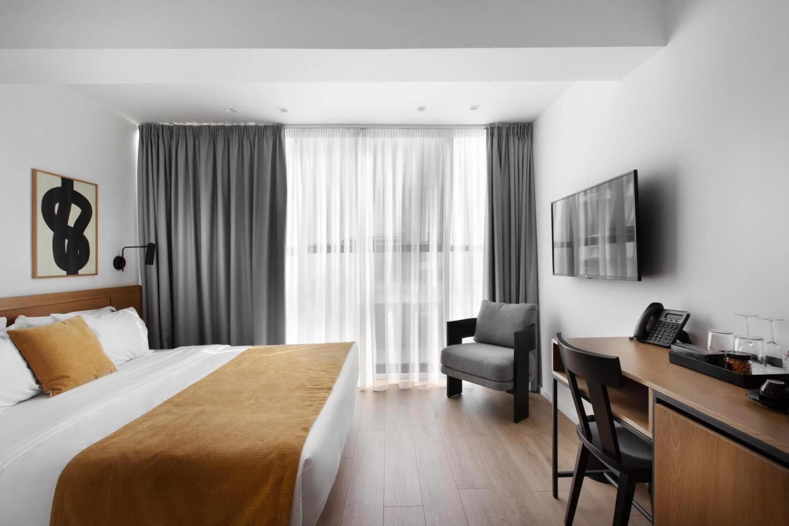 Communal lounge/ TV room, Bed in Noa Hotel