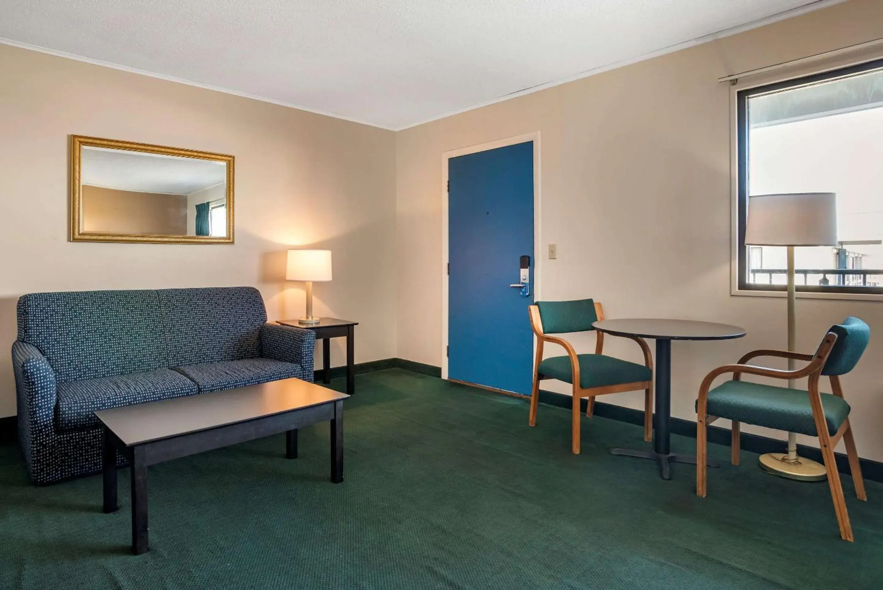 Bedroom, Seating Area in Rodeway Inn & Suites - Rehoboth Beach