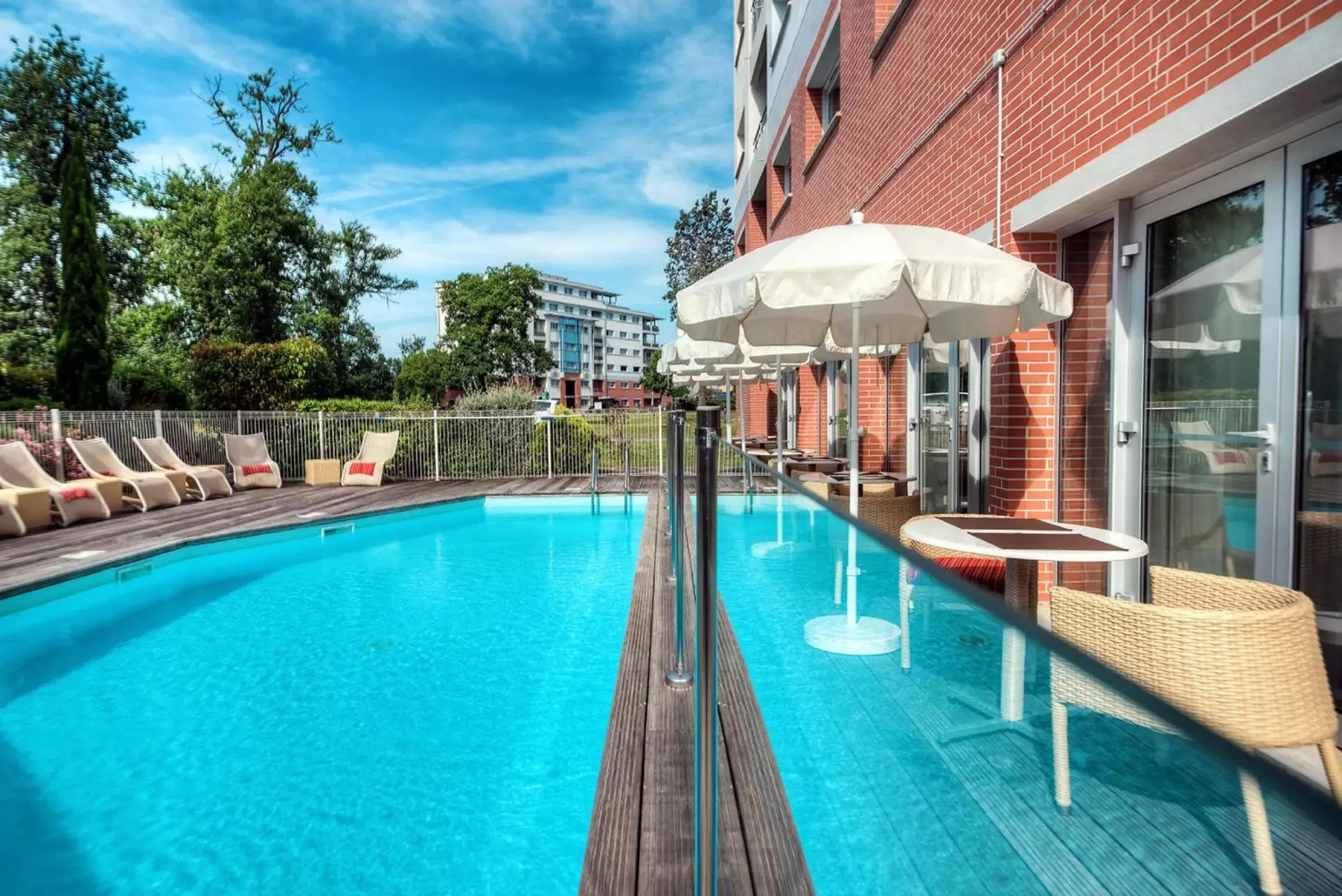 Swimming pool, Property Building in Zenitude Hôtel-Résidences Le Parc de l'Escale