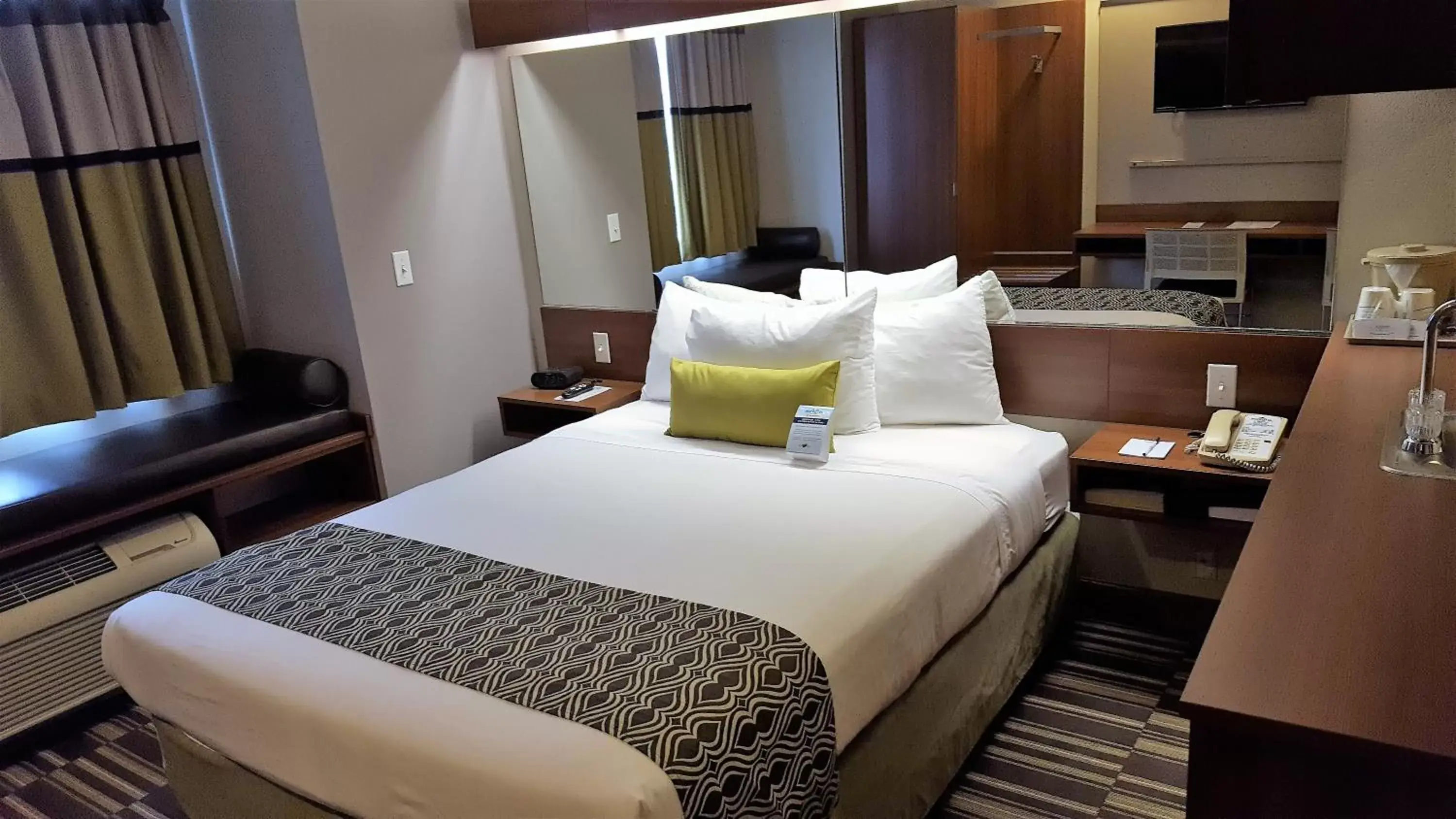 Bed in Microtel Inn & Suites by Wyndham Bellevue